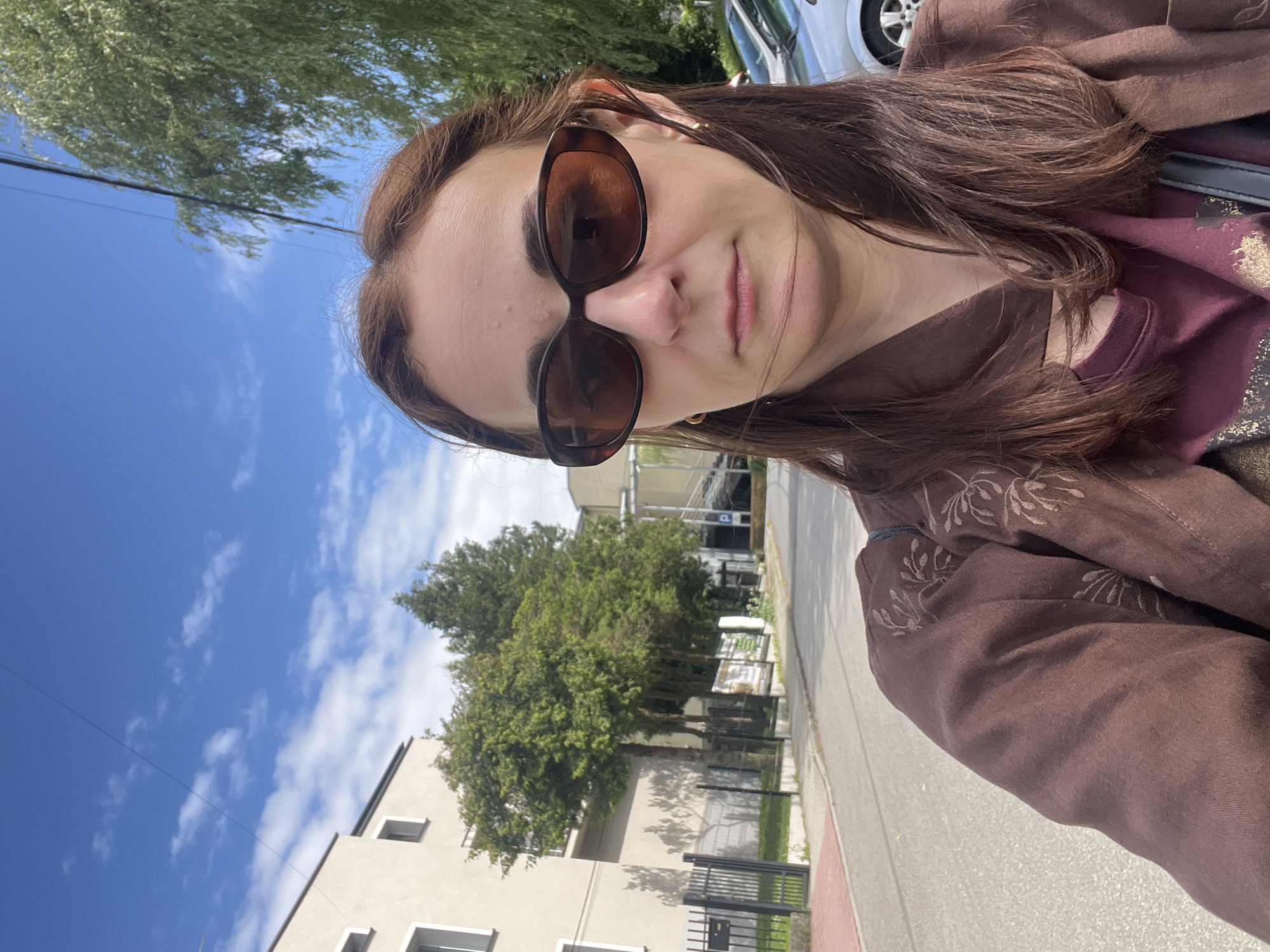 Woman documents sunny afternoon at swimming pool complex