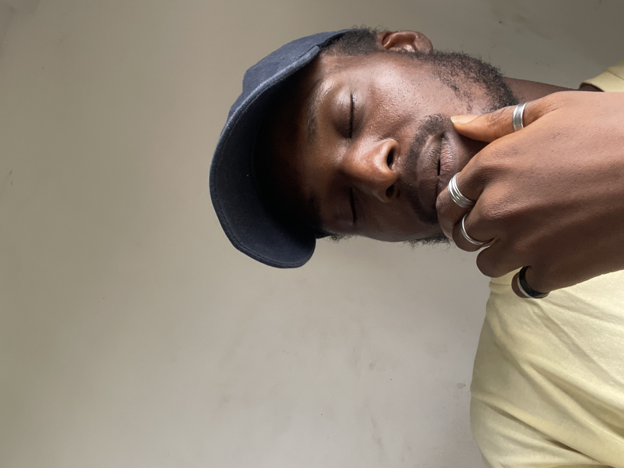 Abuja chill session with rings, a cap, and a #FreakyFriday post