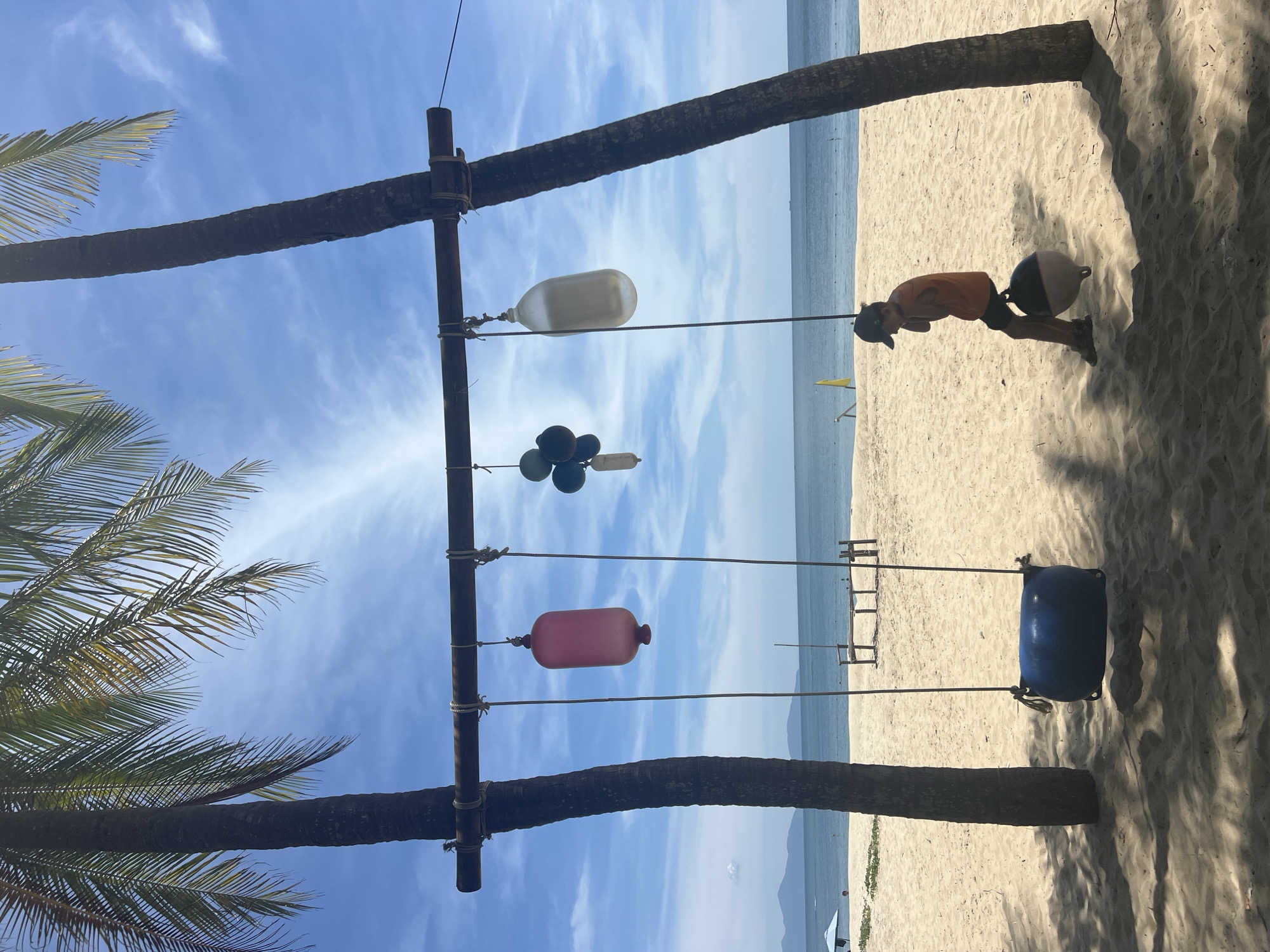 Sun, palms, and beach installations at Hoi An's coastline