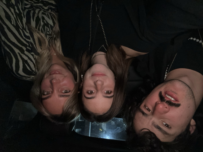 Three friends pose for late-night photo in Mexico City