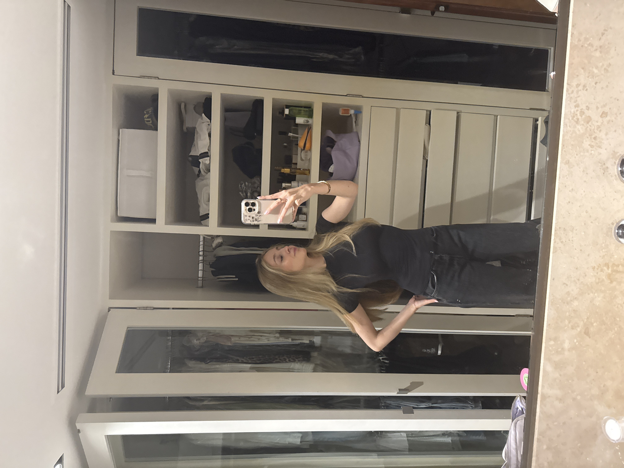 Woman takes mirror selfies in Mexico City closet