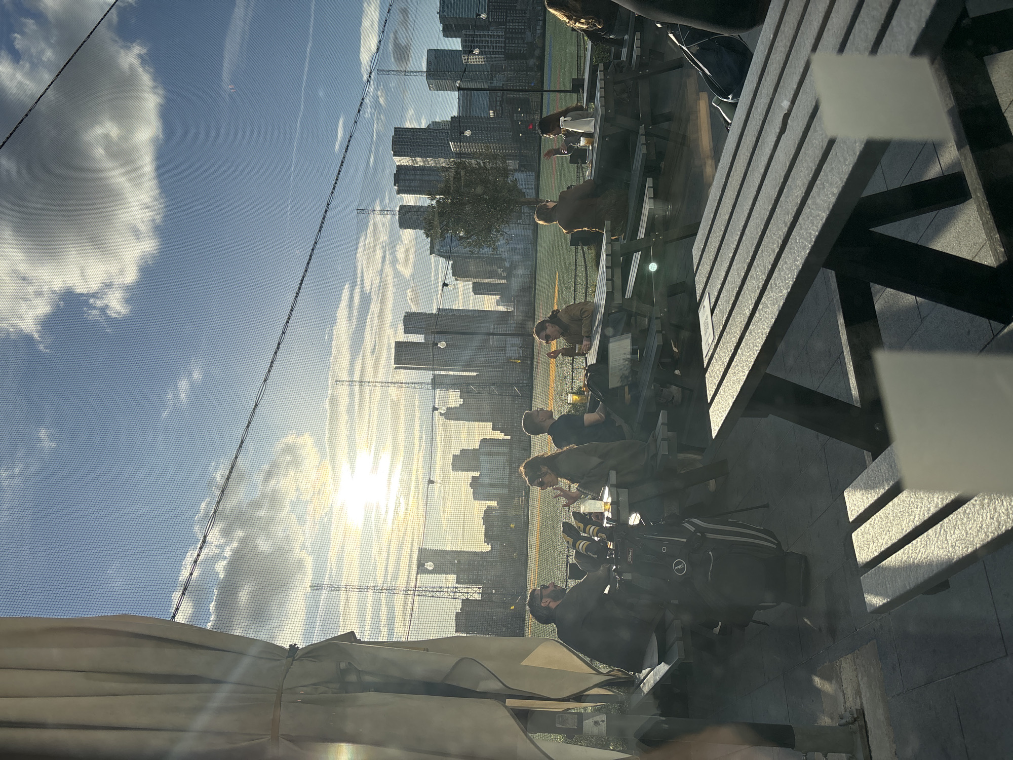 London scenes: golf range and cafe moments captured simultaneously