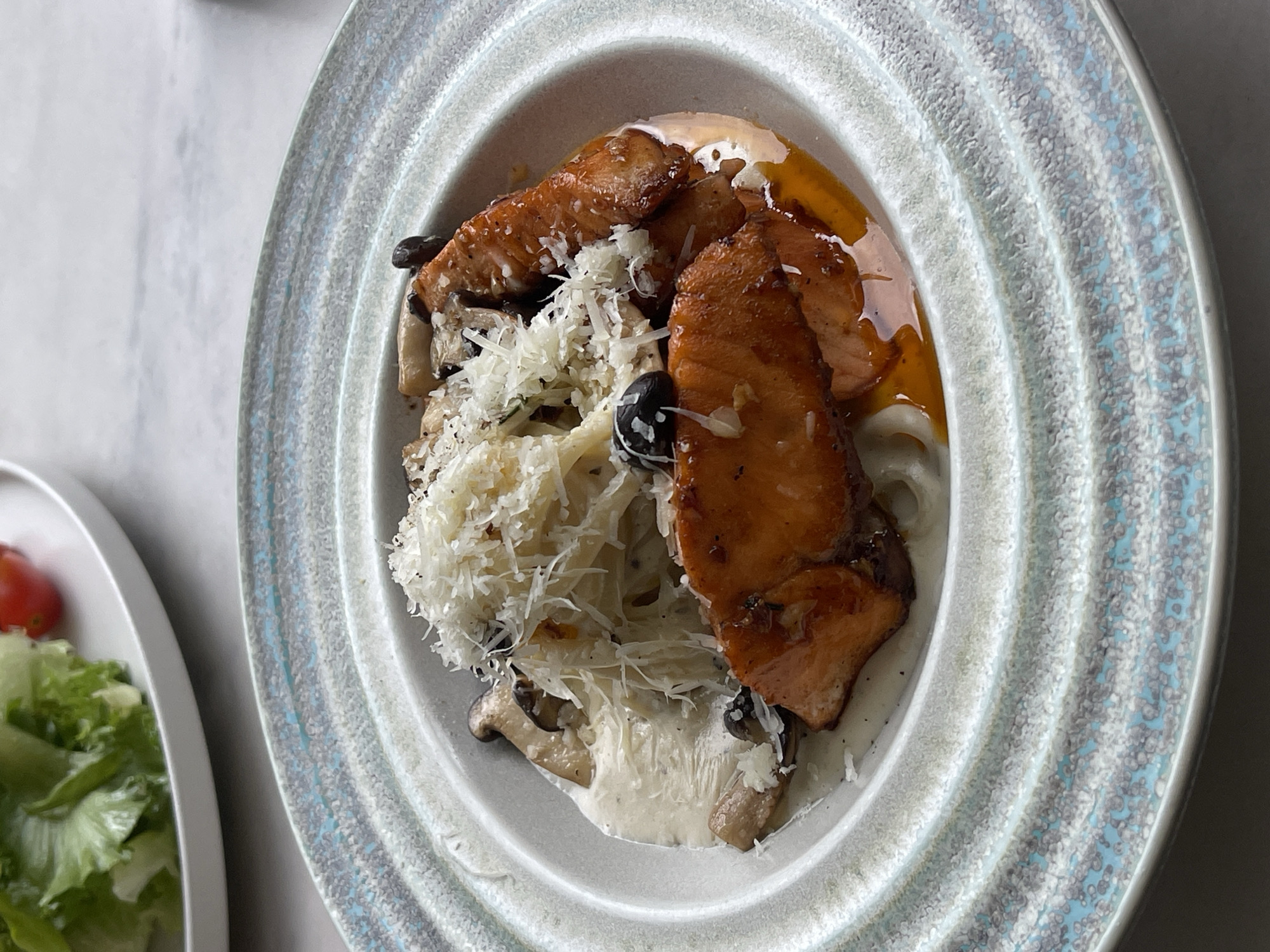 Salmon pasta meal documented in Da Lat, Vietnam