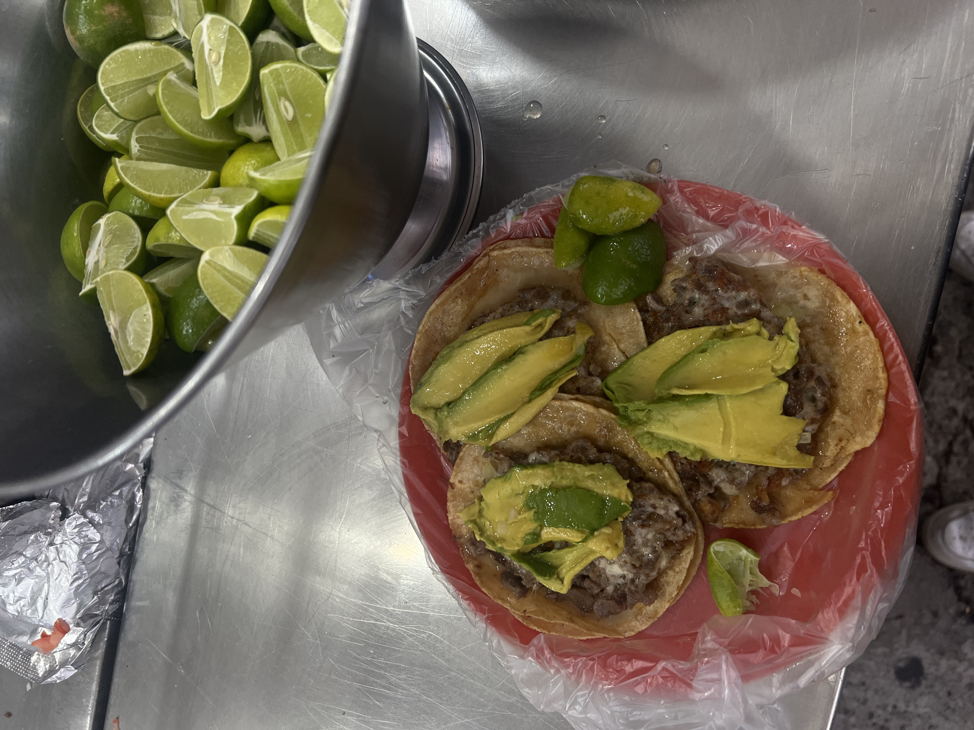 Late-night taco preparation documented at Mexico City food counter