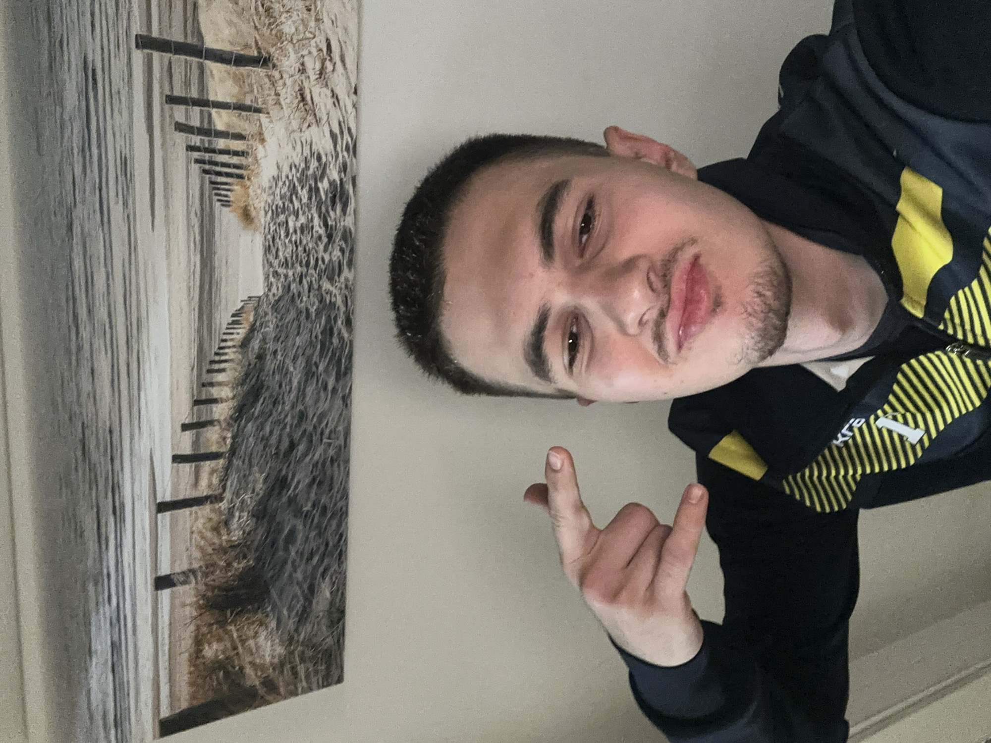 Young man poses for indoor photo in Sofia