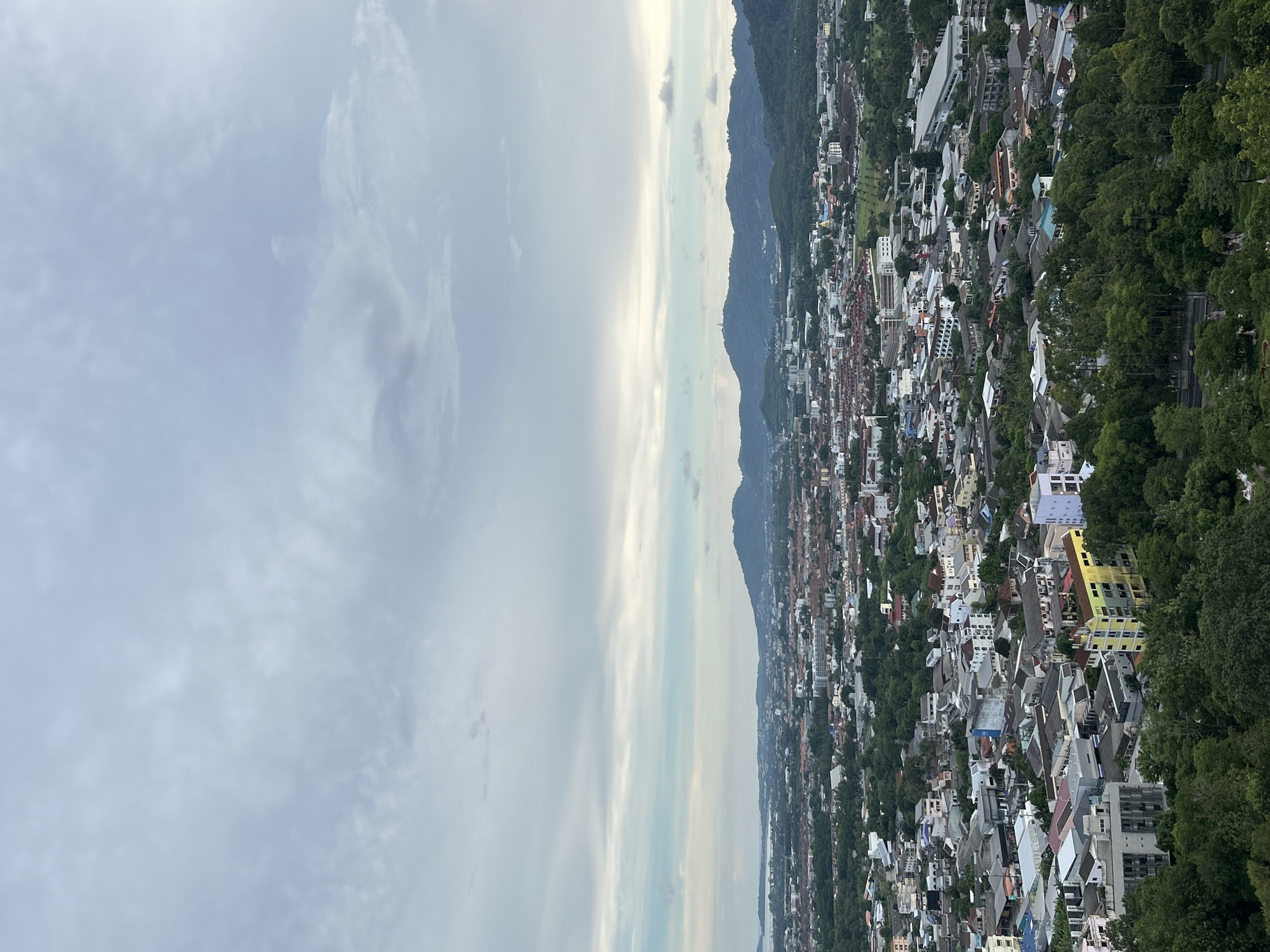 Scenic viewpoint gathering in Ratsada draws visitors and street musician