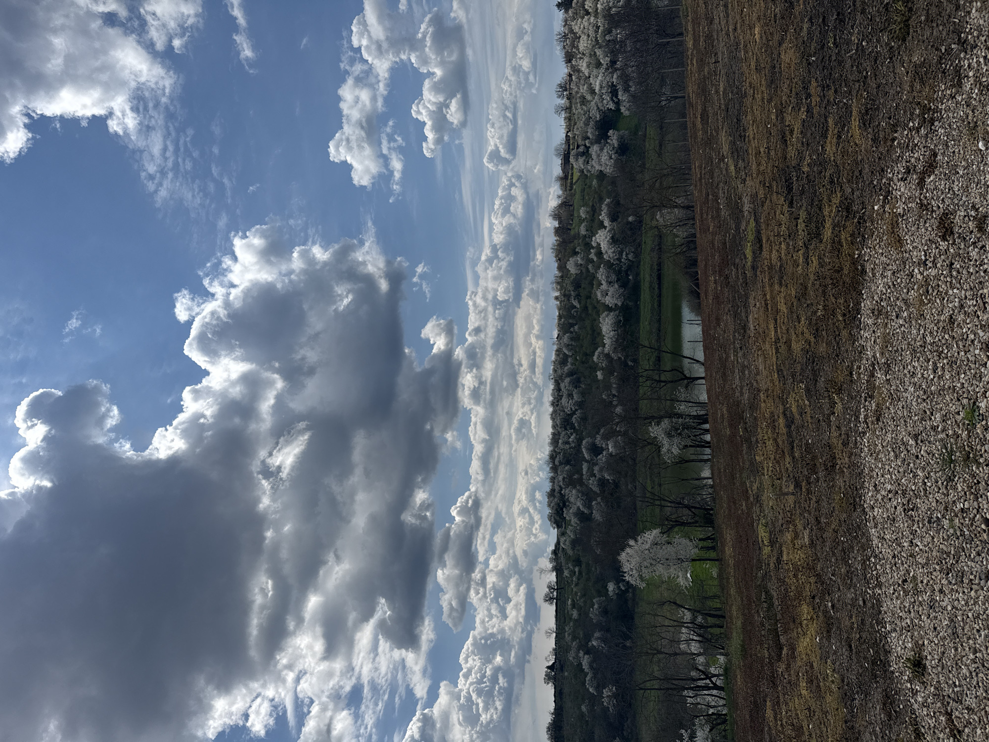 Rural landscape with mixed clouds observed in Bulgaria