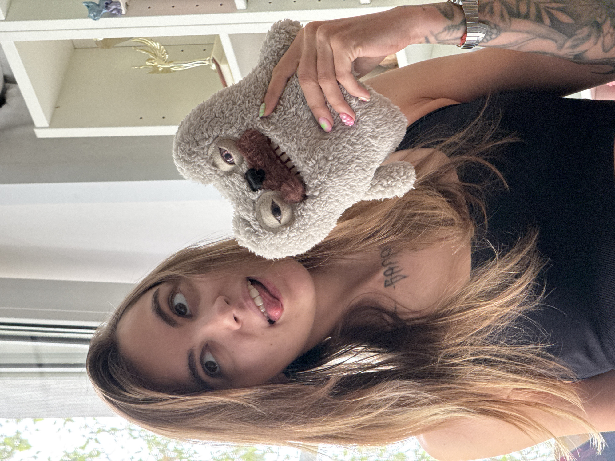 Goofing around with a plush toy in a Moscow room