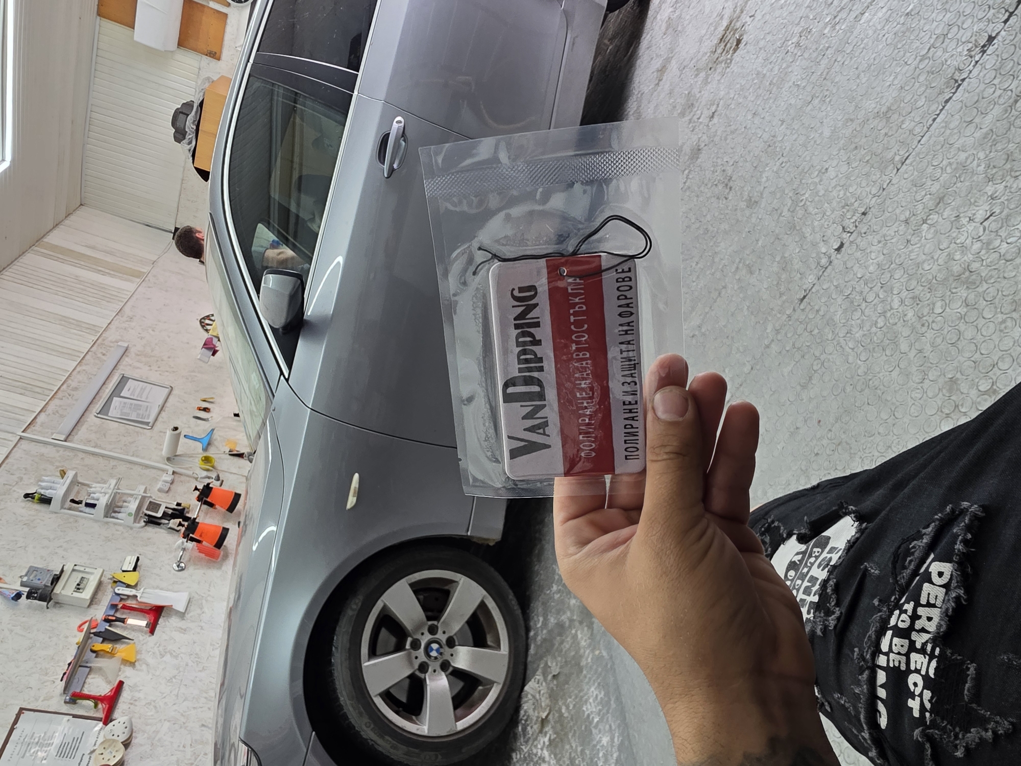 VanDIPPING branded black air freshener shown up close