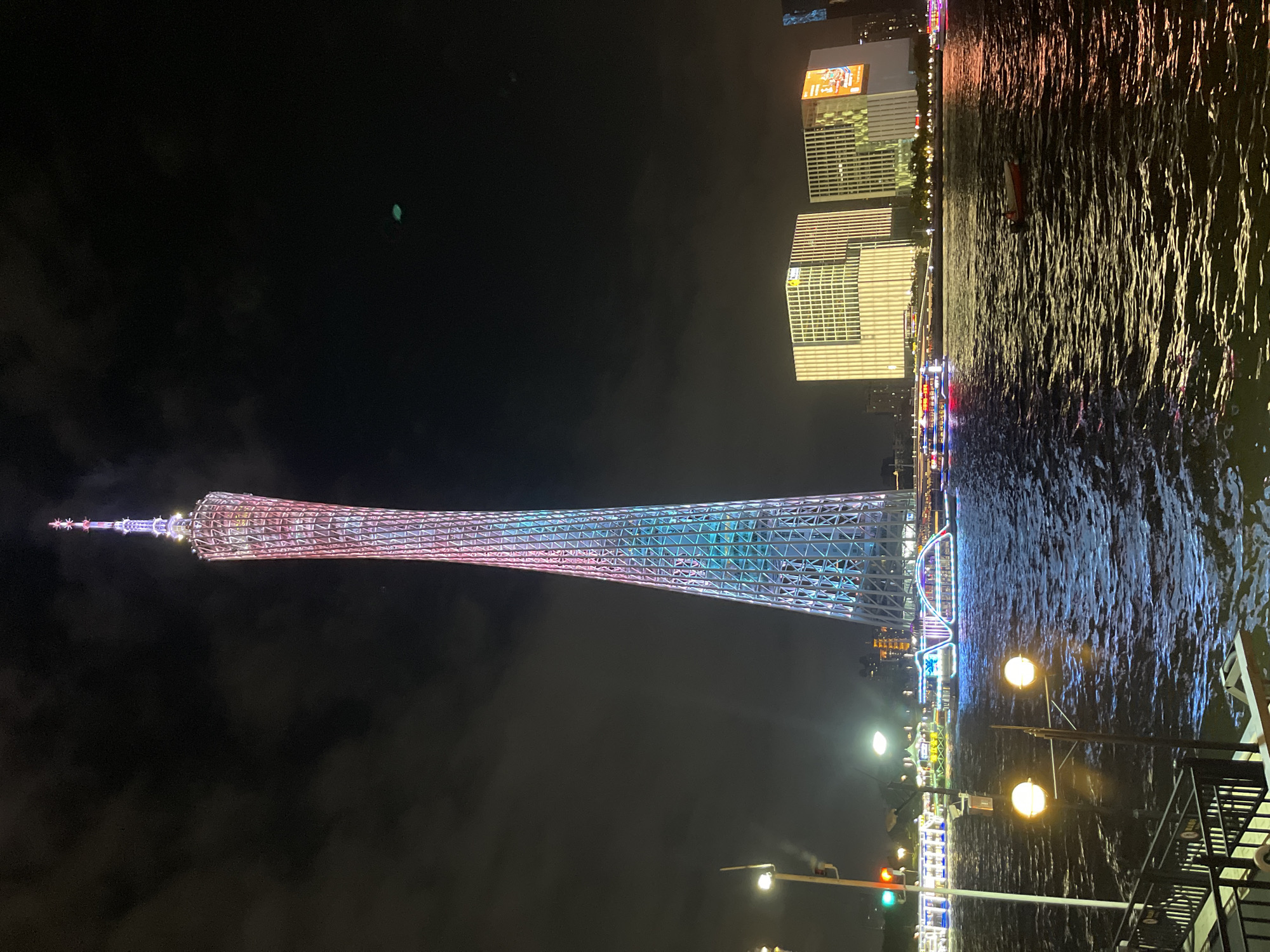 Guangzhou's Tianhe waterfront lights up on a summer night