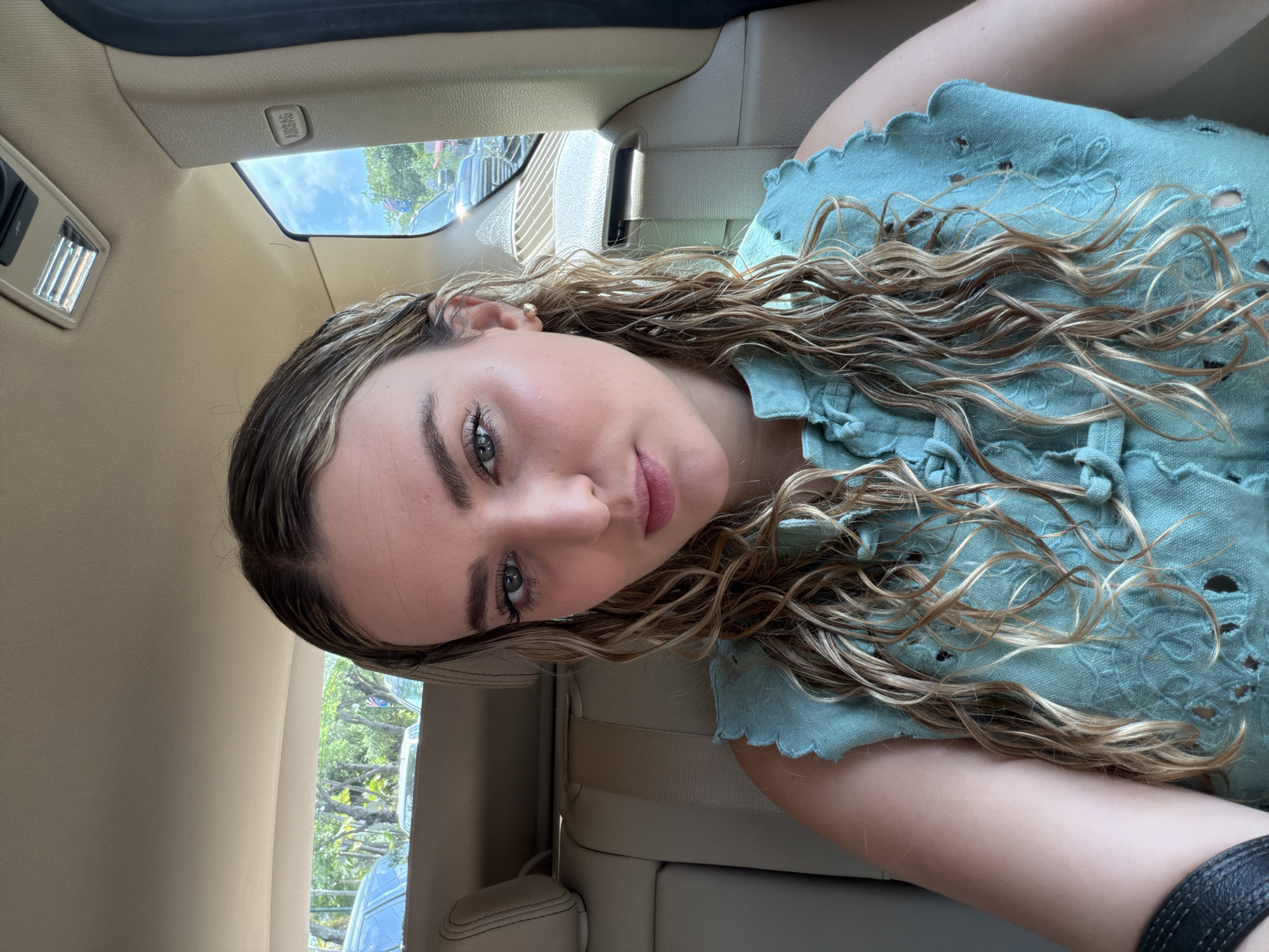 Vehicle passengers observe street scene and woman in Key Biscayne