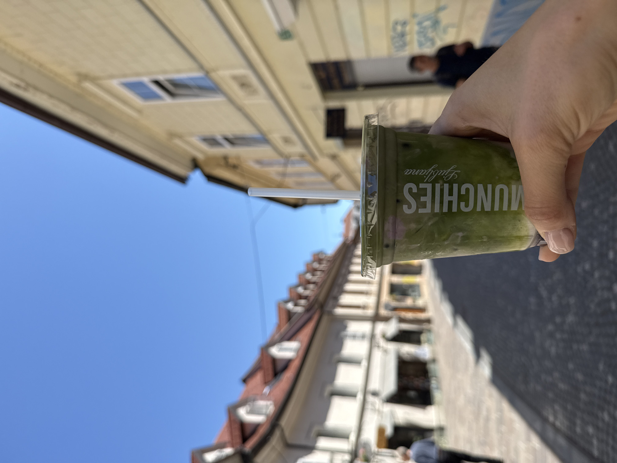 Tourist documents morning walking tour of Ljubljana's historic center