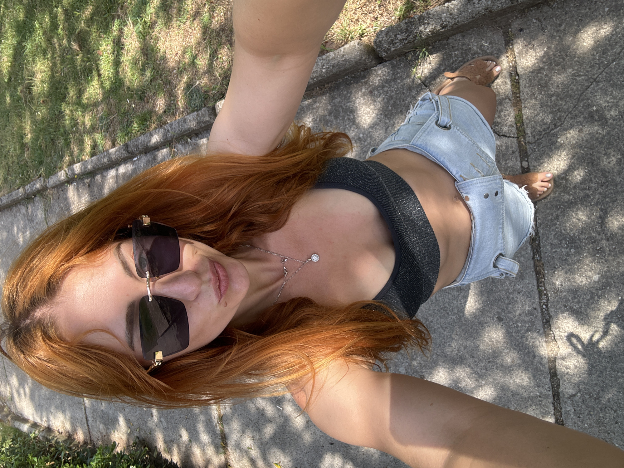 Woman takes selfies in Budva park during morning walk