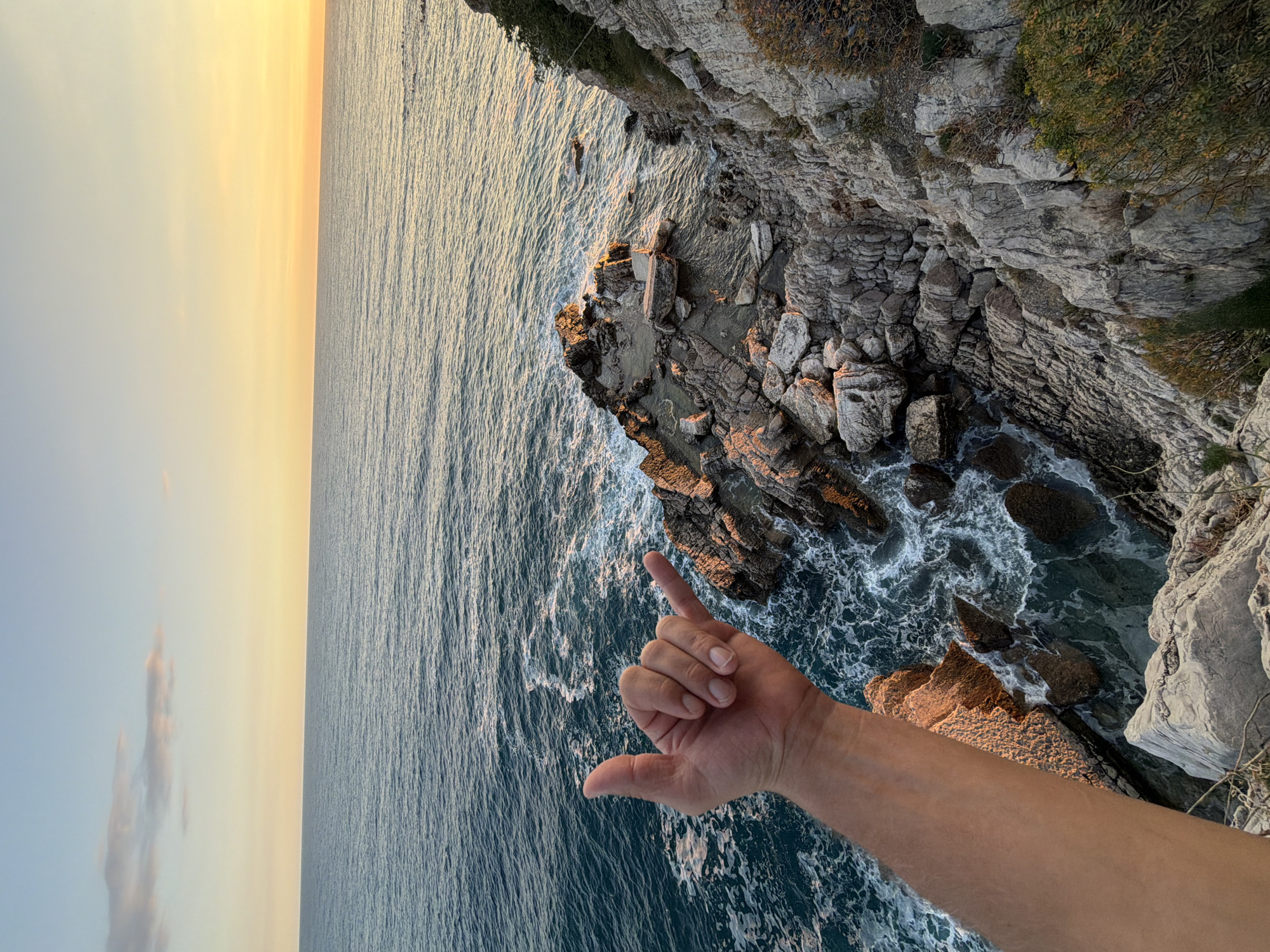 Dog walker enjoys coastal cliff walk in Montenegro