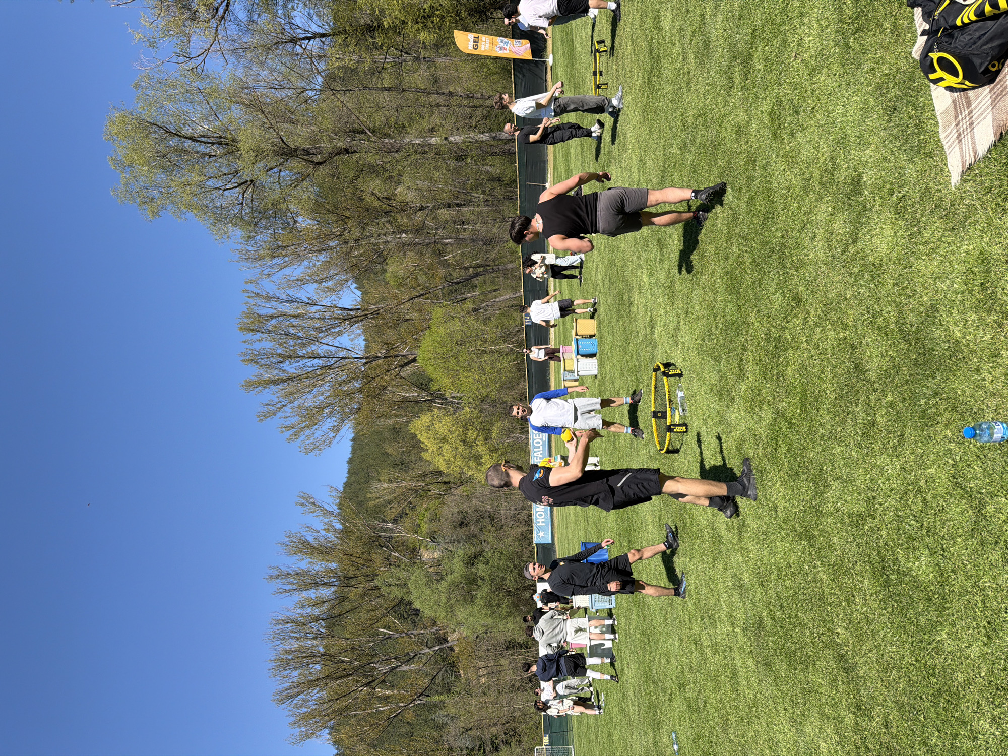 Group plays outdoor games in Bulgarian park on sunny morning