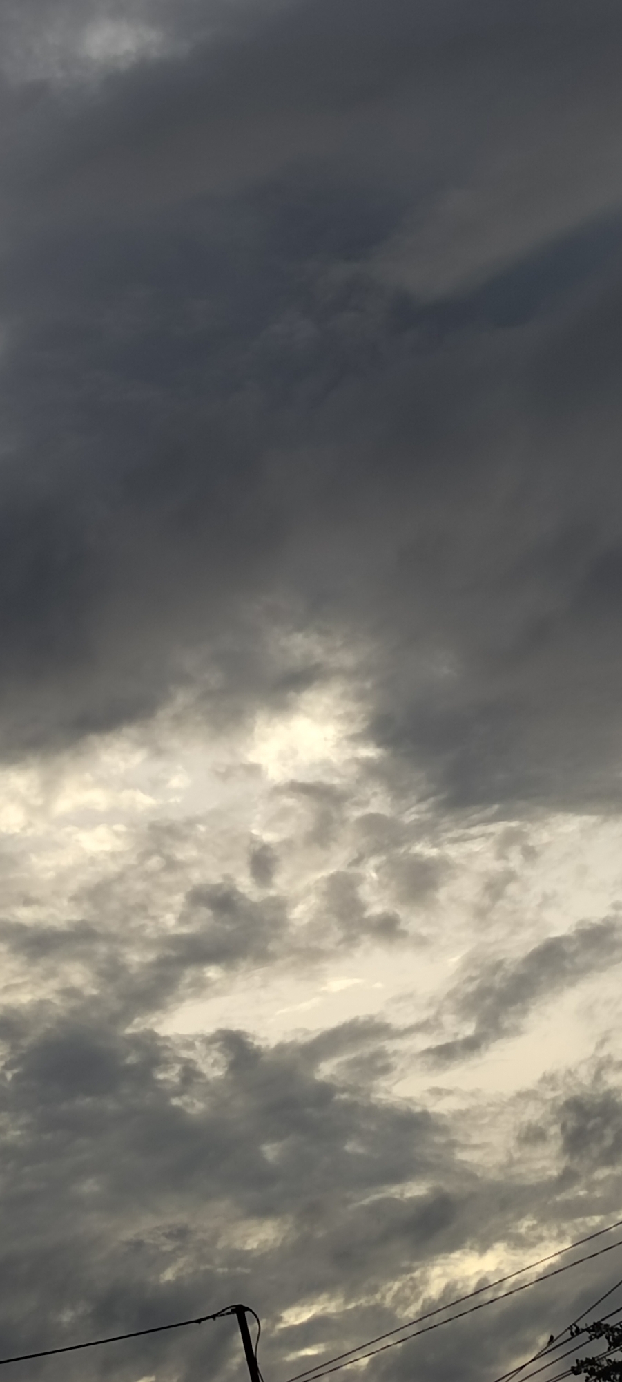 Shifting cloud formations observed over Peurupok, Indonesia