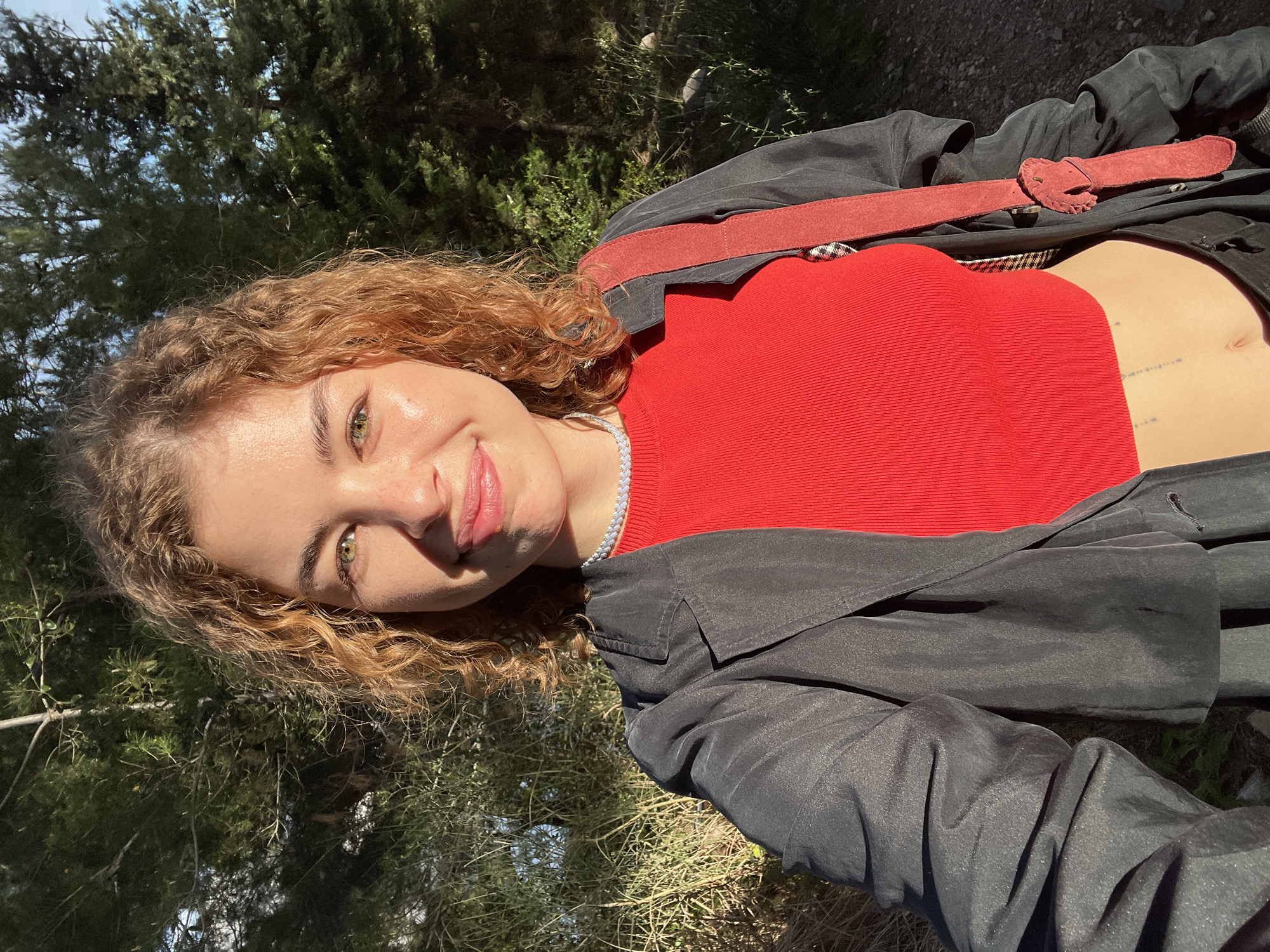 Portrait captured of person in red-belted coat, Budva