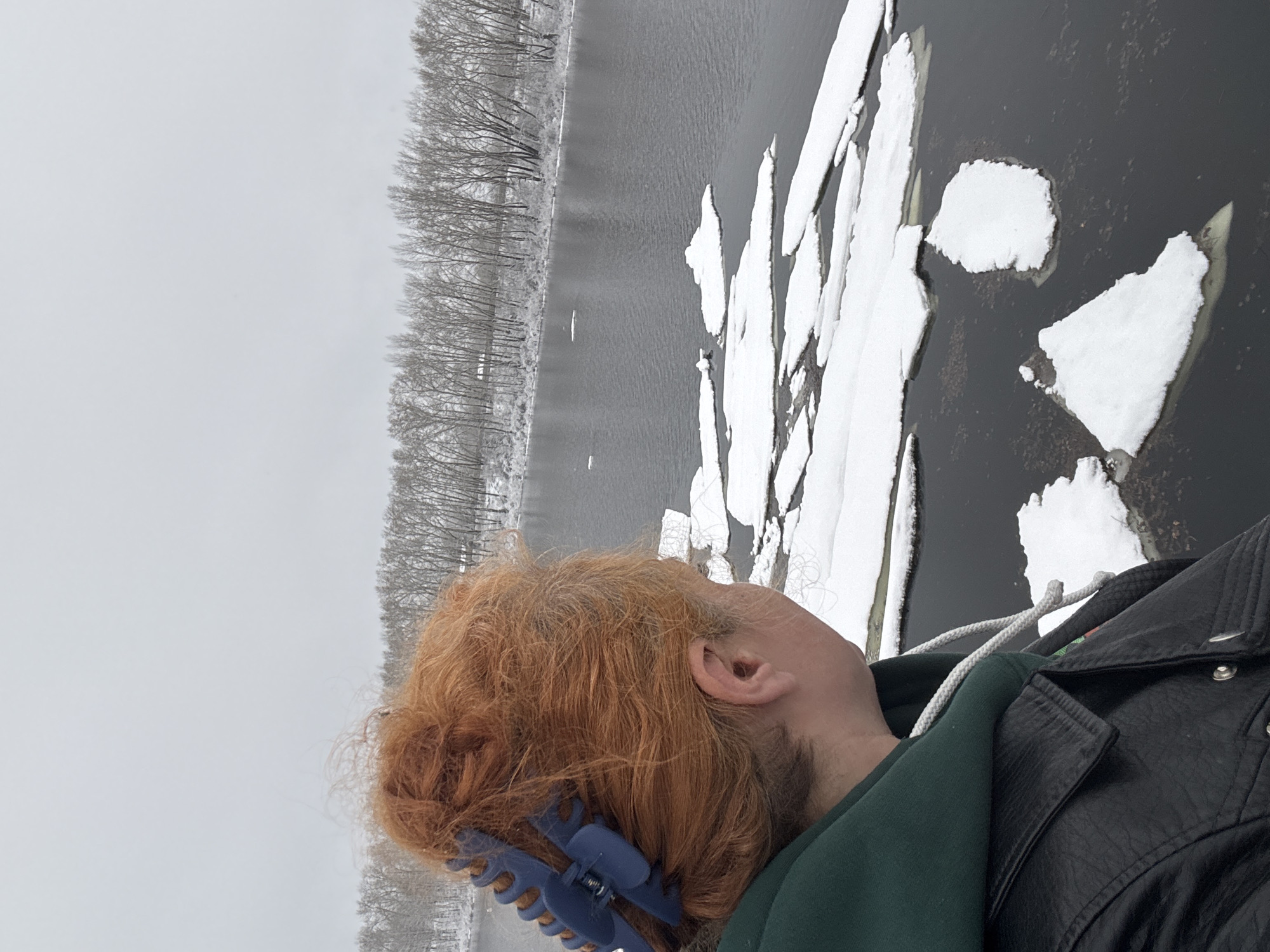 Winter documentation along frozen waterway in Chaikovsky, Russia