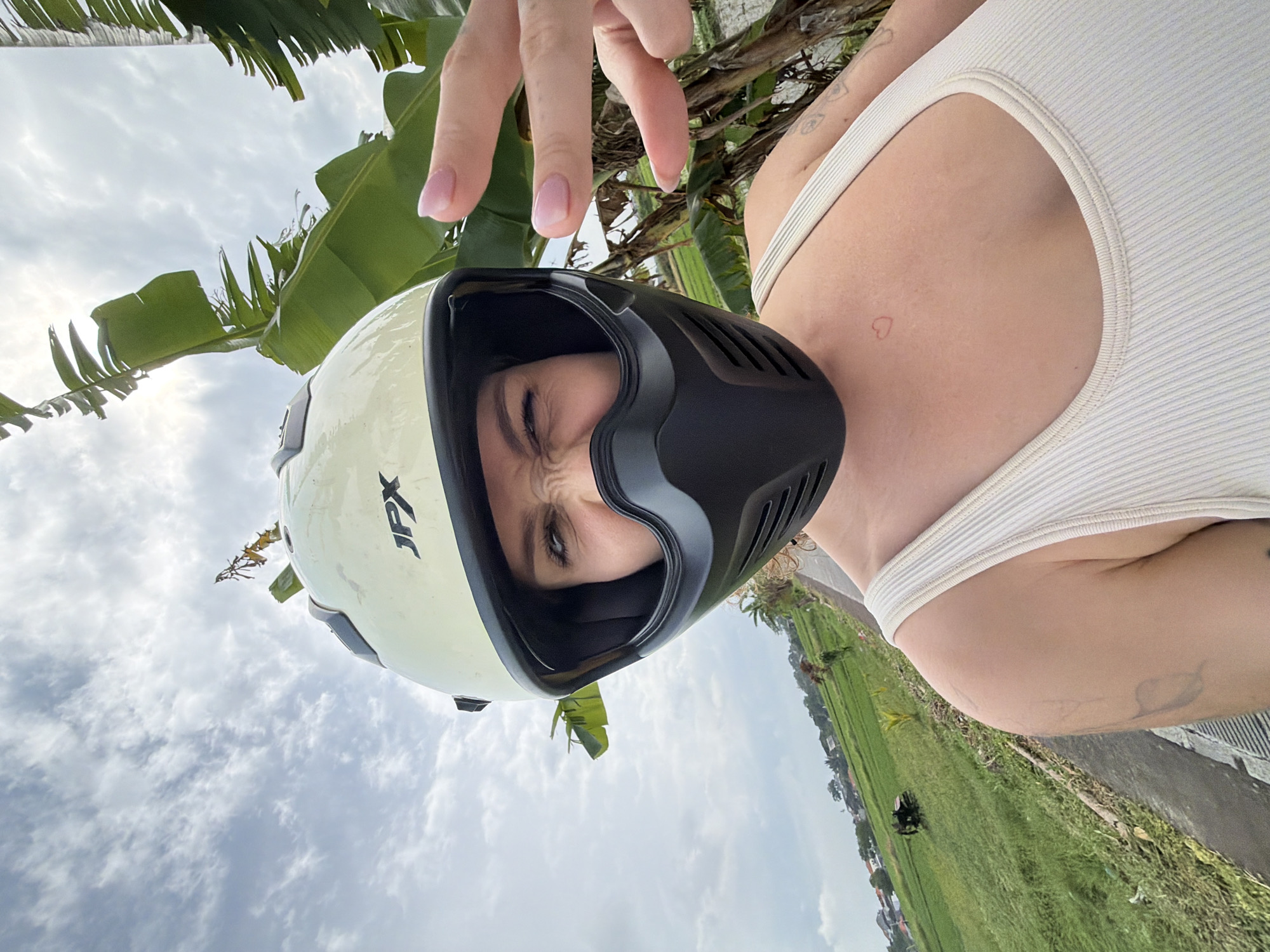 Late-night motorcycle ride captured through North Kuta rice paddies