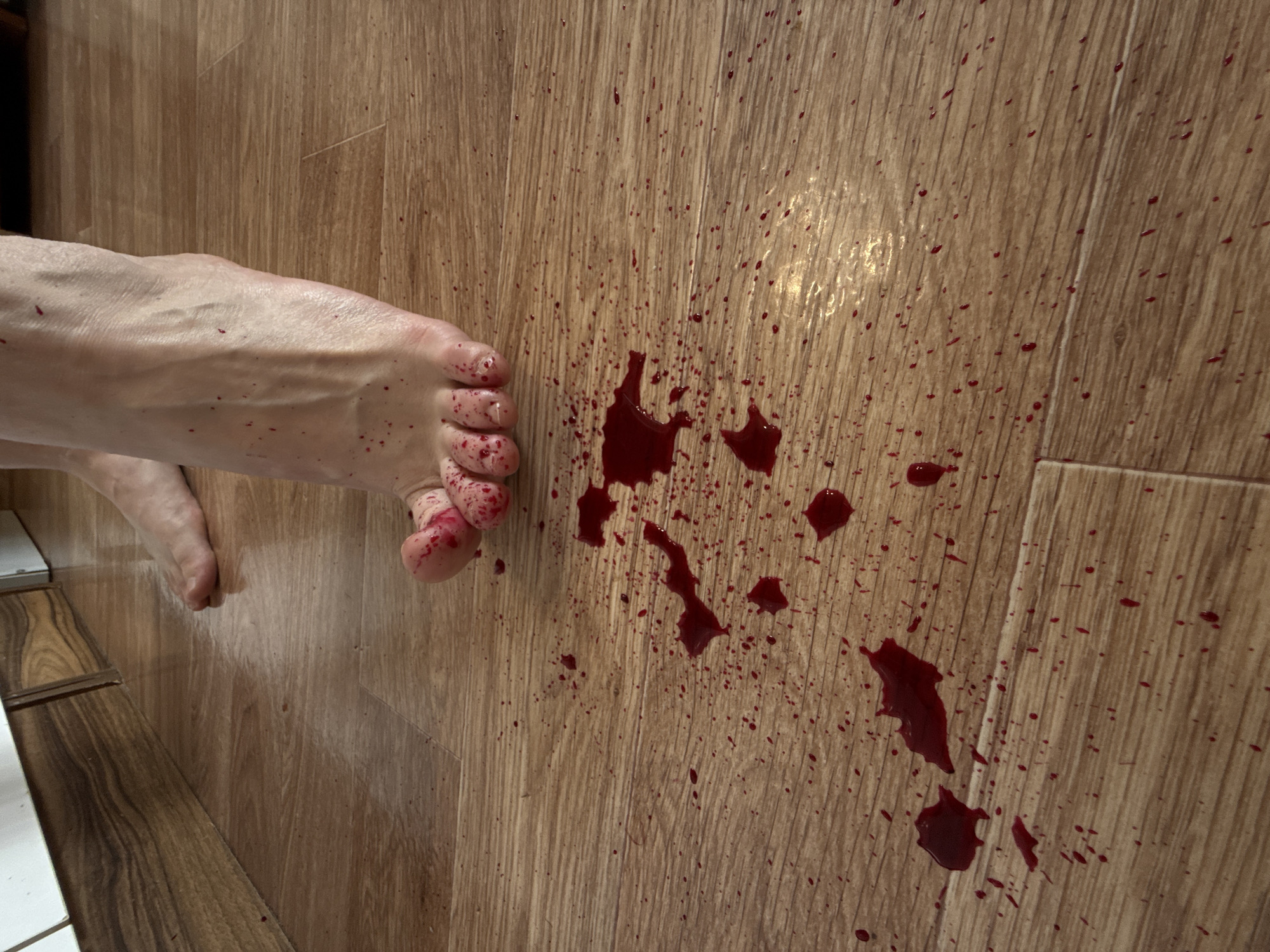 Red liquid spill documented on floor in Krasnoyarsk