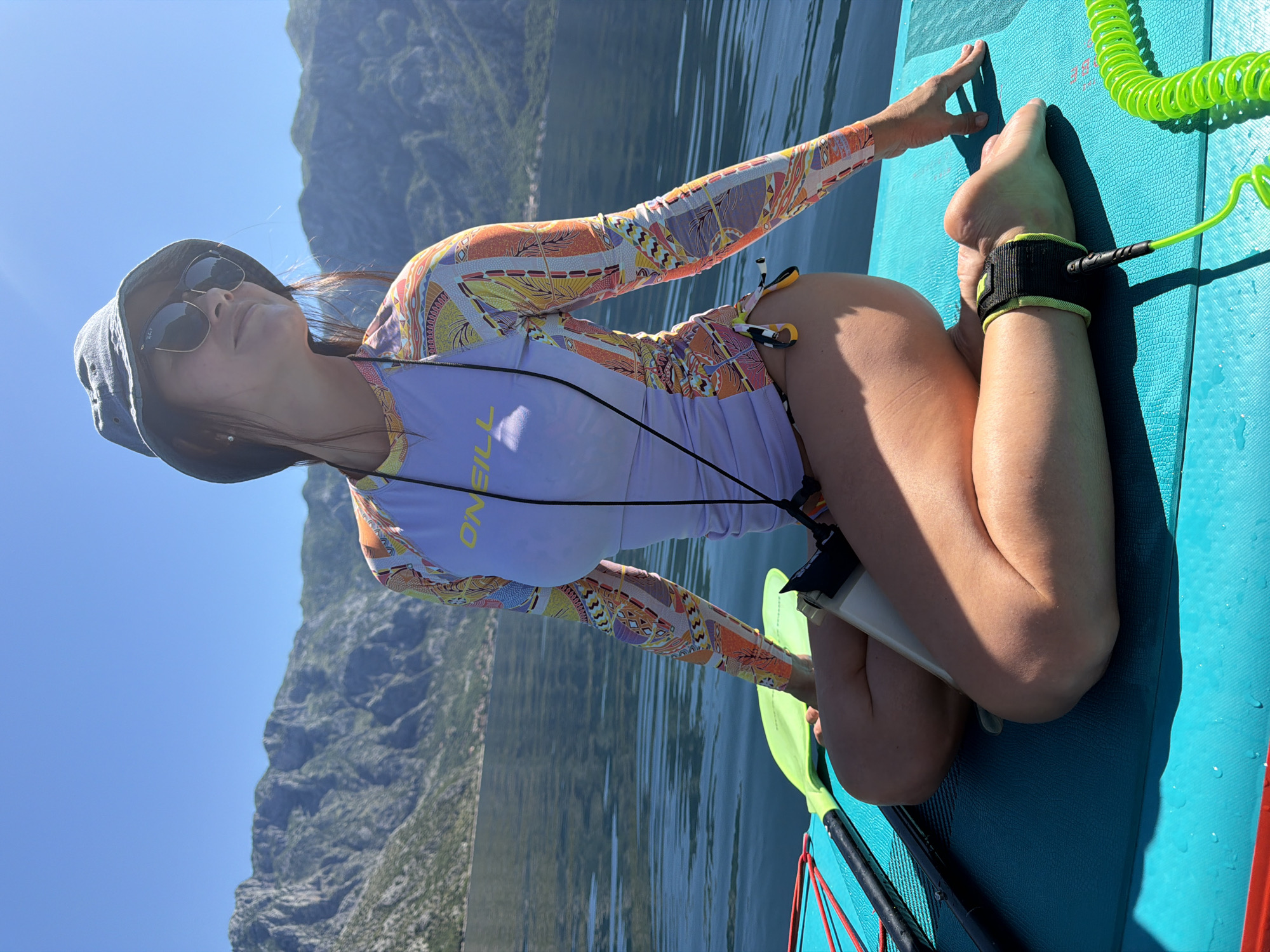 Paddleboarders enjoy morning waters near Stoliv, Montenegro