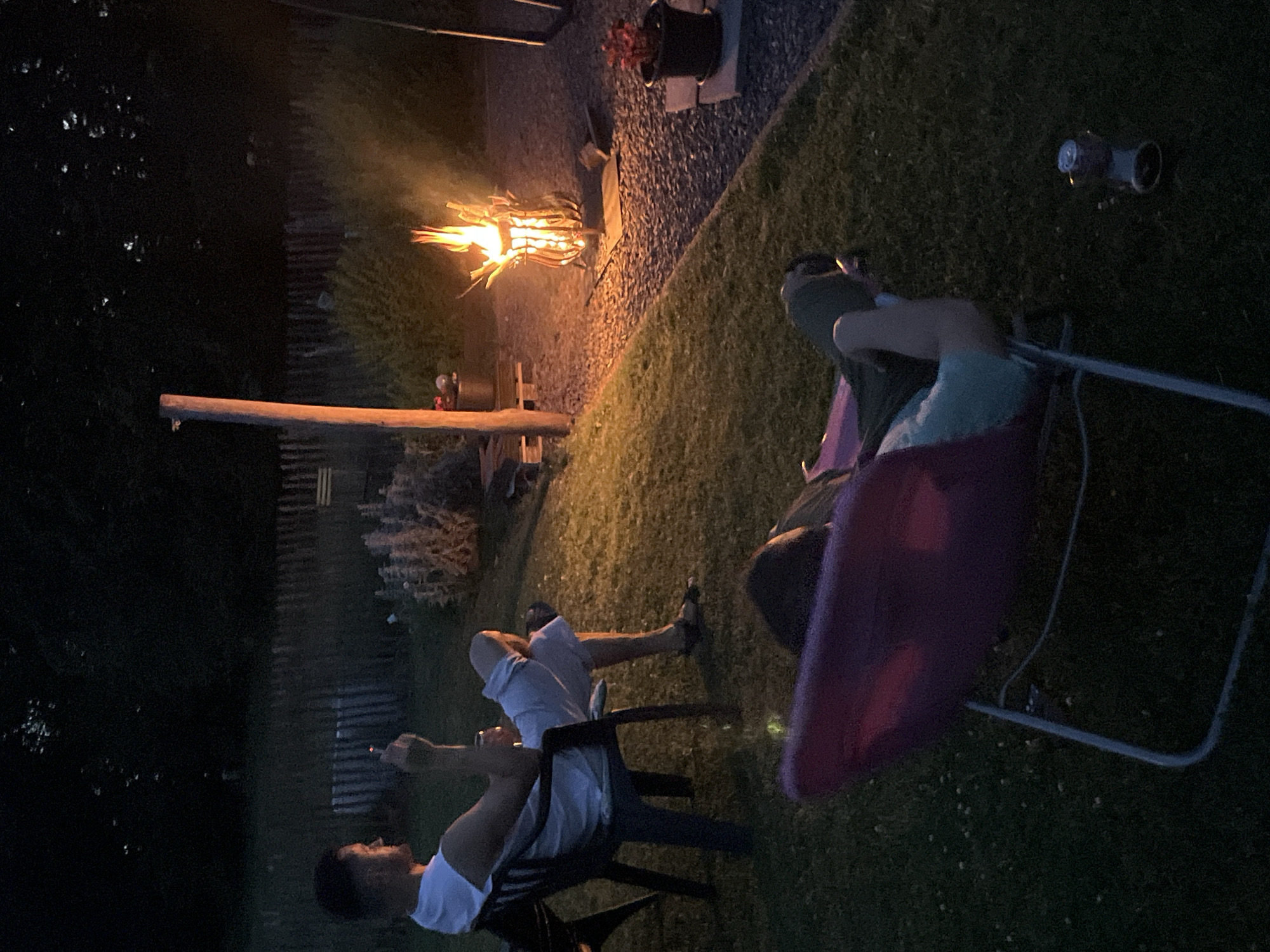 Backyard fire pit gathering on a summer evening