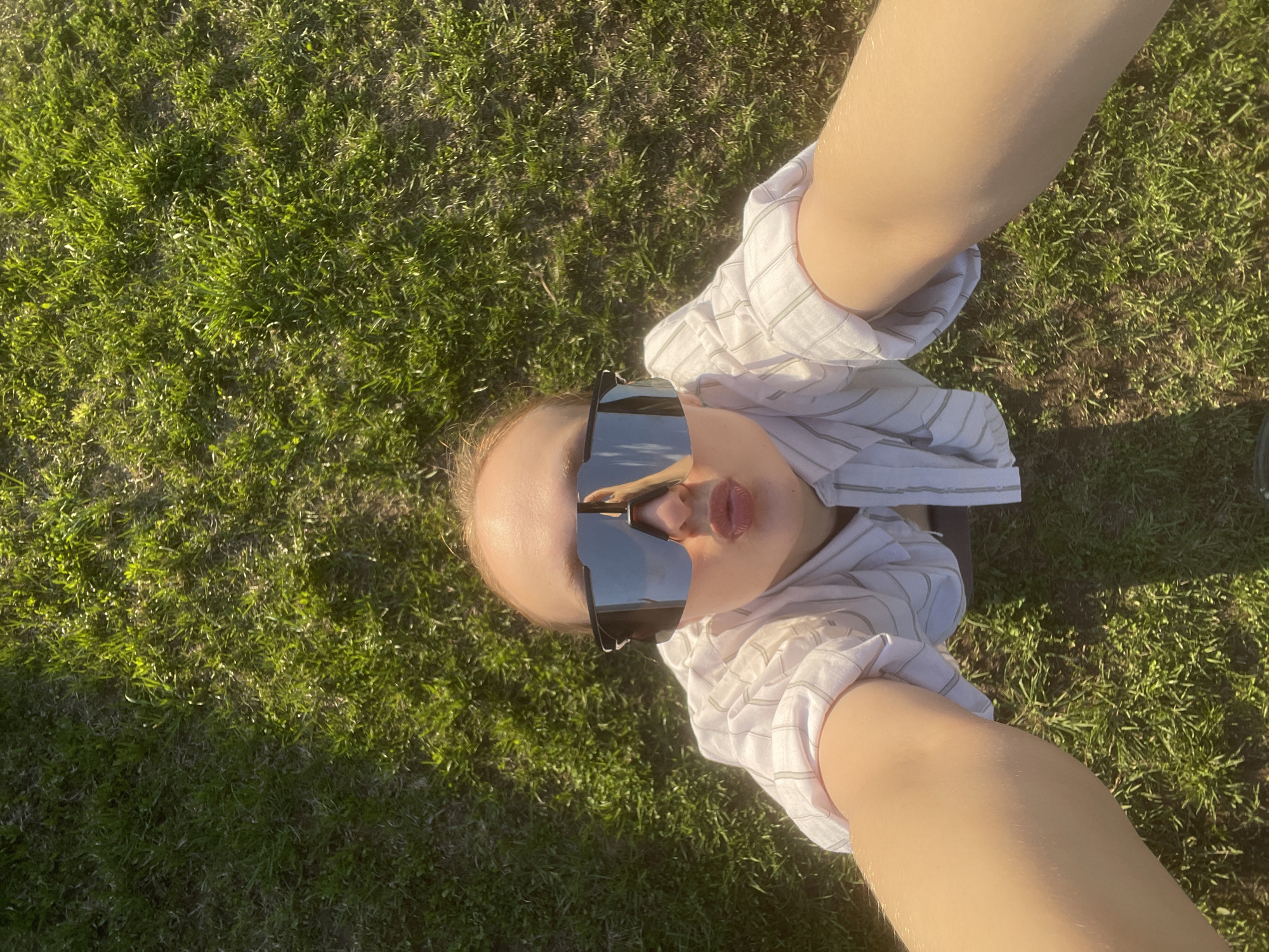 Person photographed with sunglasses on grass in Подшивалово, Russia