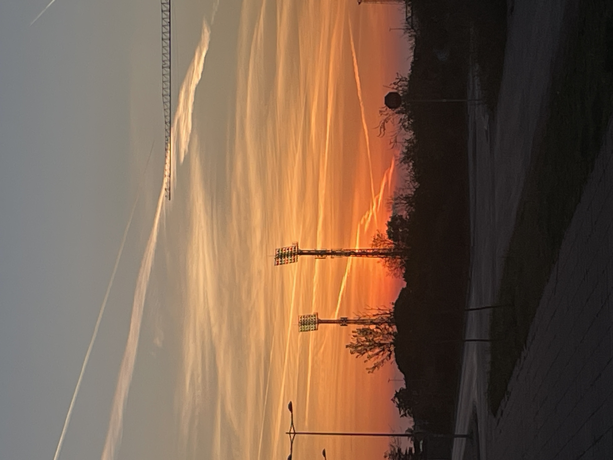 Sunset documented across Bar, Montenegro with prominent airplane contrails
