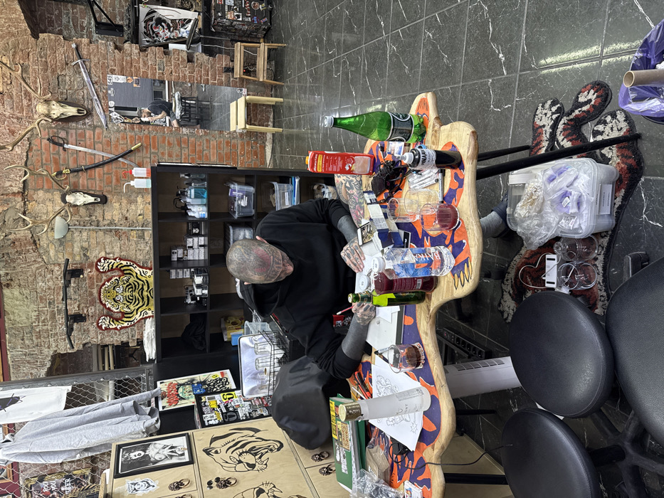 Heavily tattooed person spotted in Moscow tattoo parlor