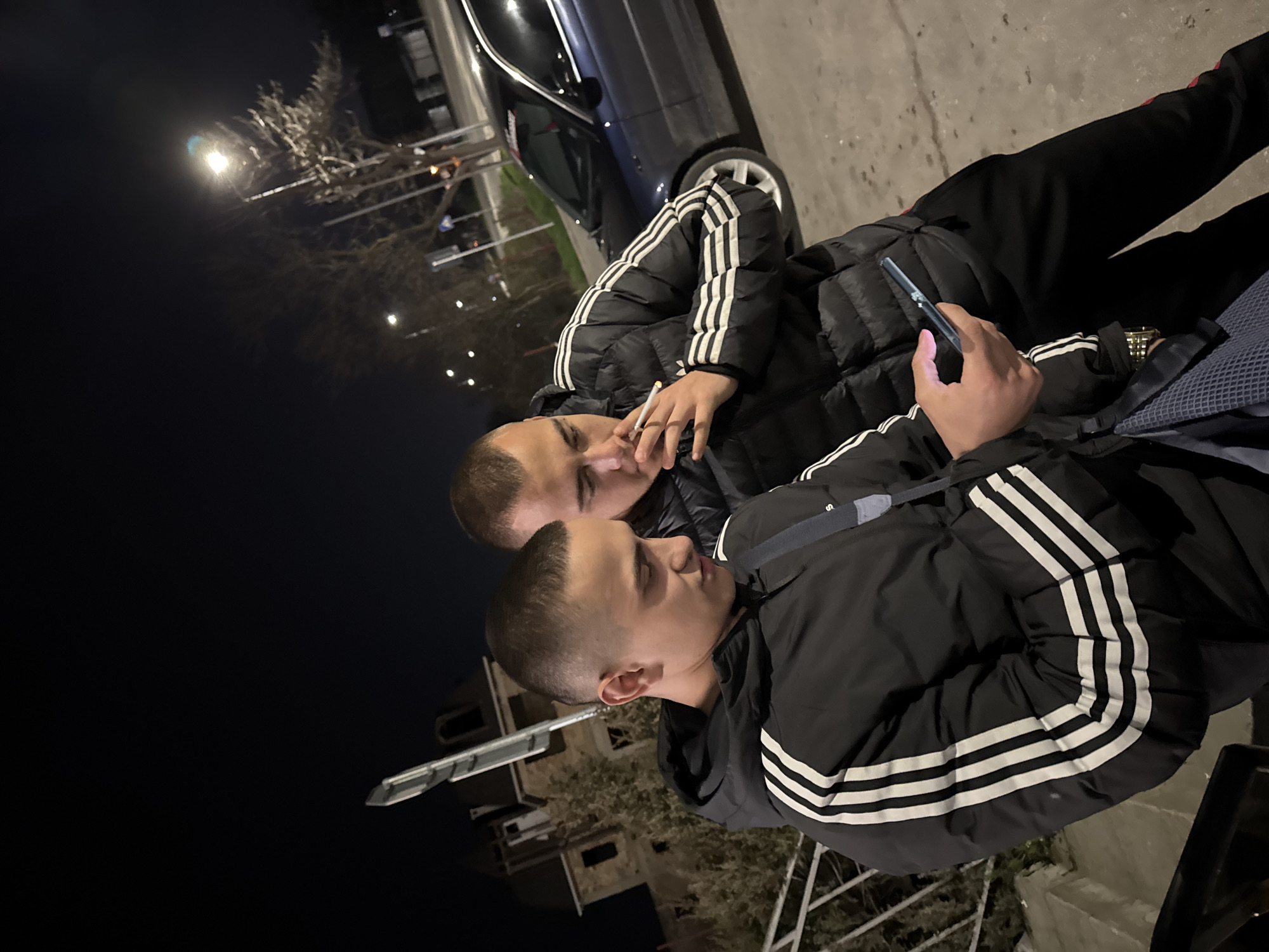 Young men hang out at night in Topoli, Bulgaria