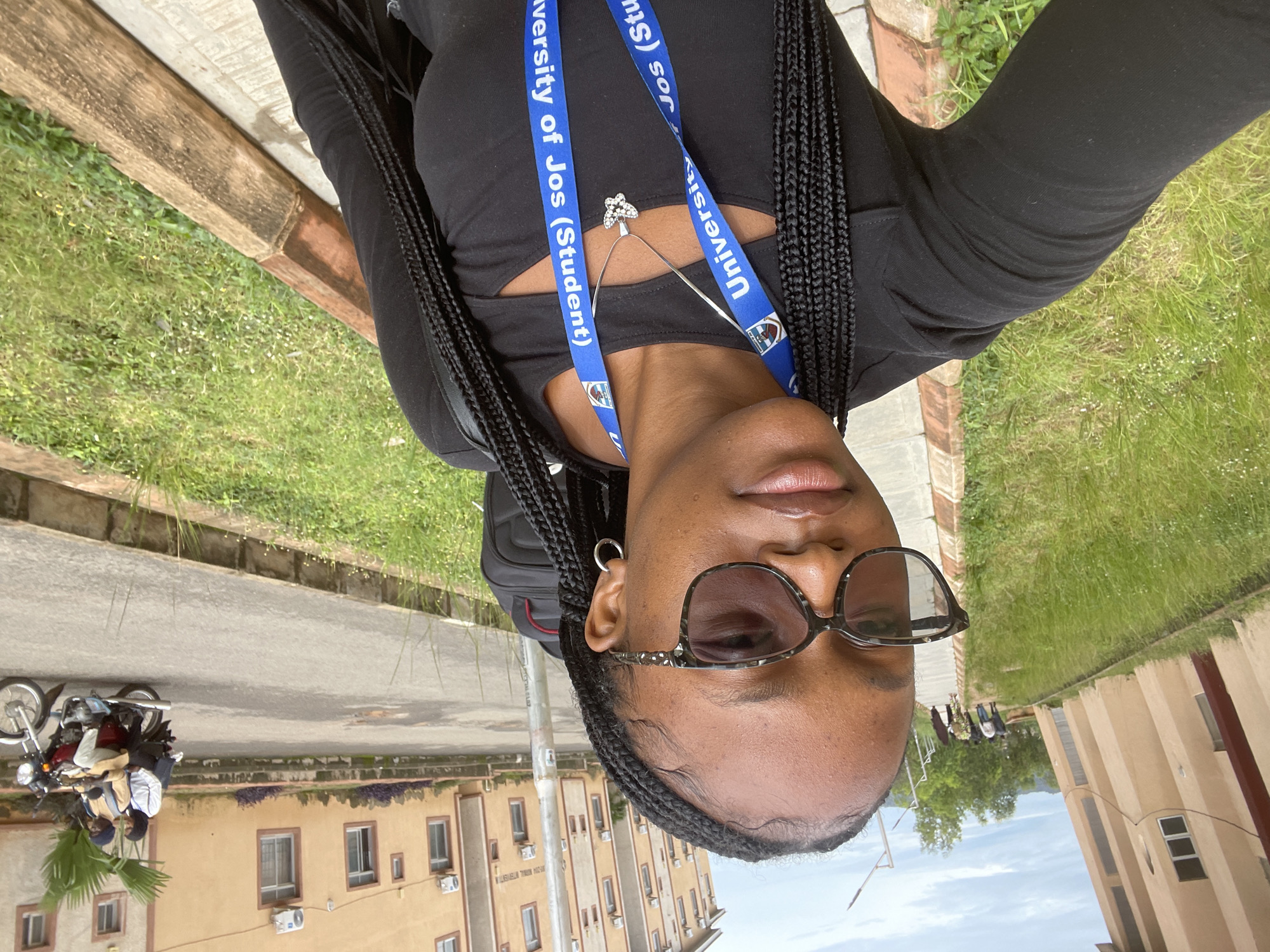 Jos street portraits and surroundings, University of Jos student lanyard visible