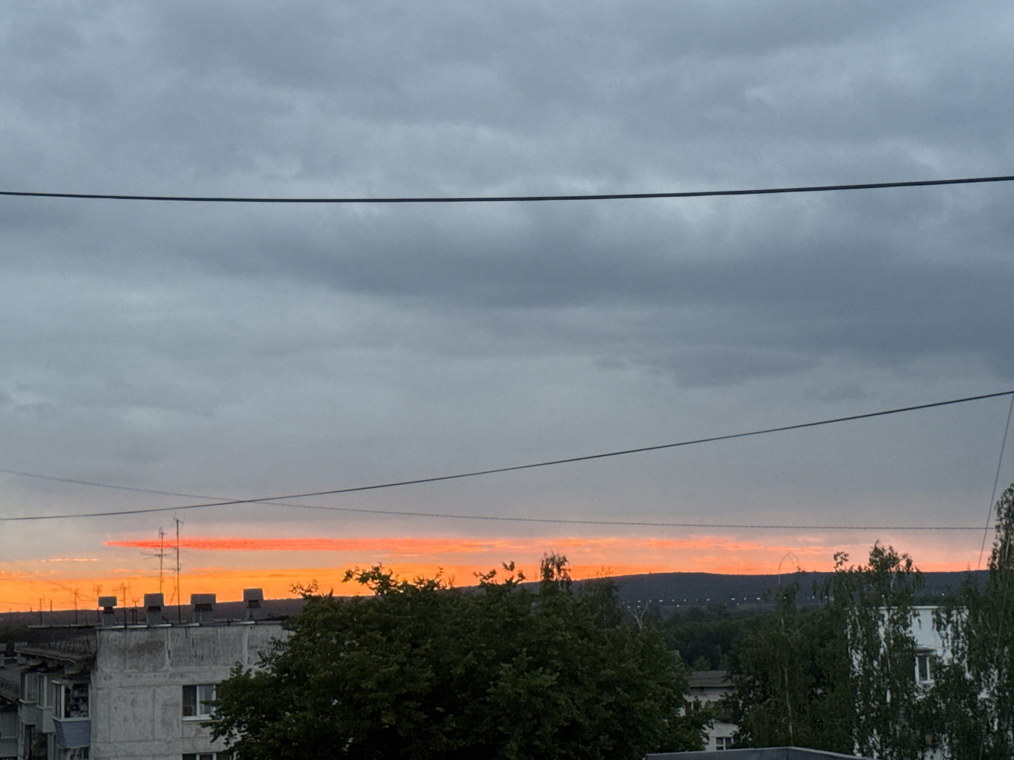 Dramatic sunset documented across Chaikovsky, Russia during evening hours