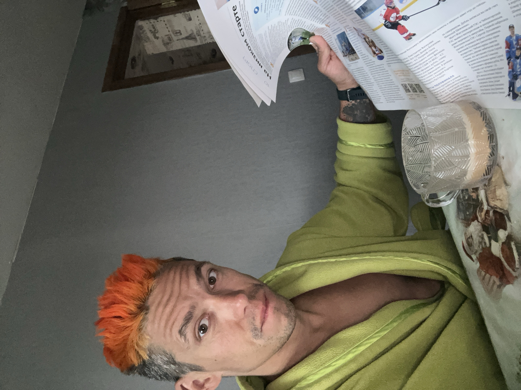 Man with orange-gray hair spotted reclining indoors in Chaikovsky