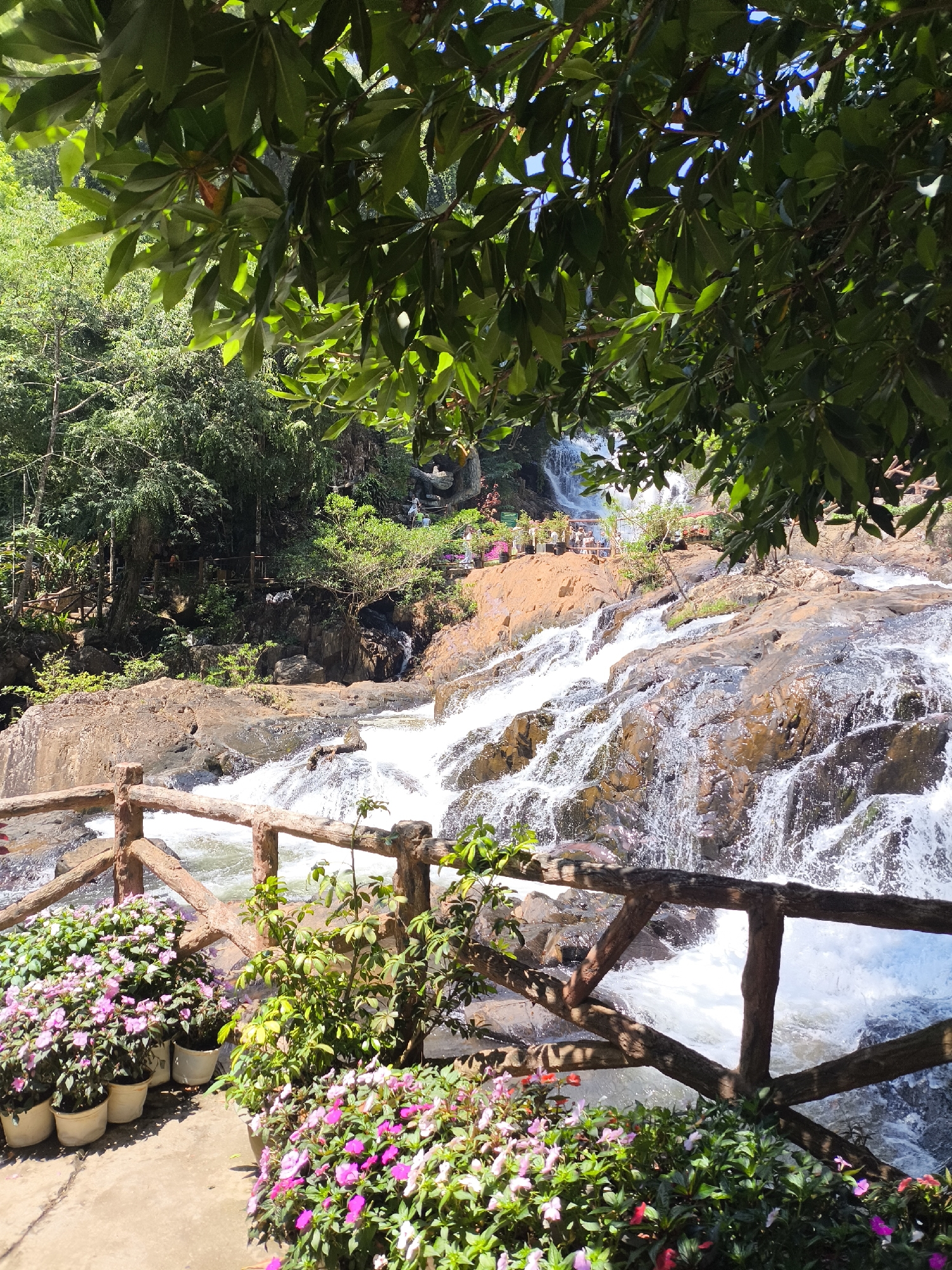 Tourists visit Datanla Waterfalls in Da Lat Vietnam early morning