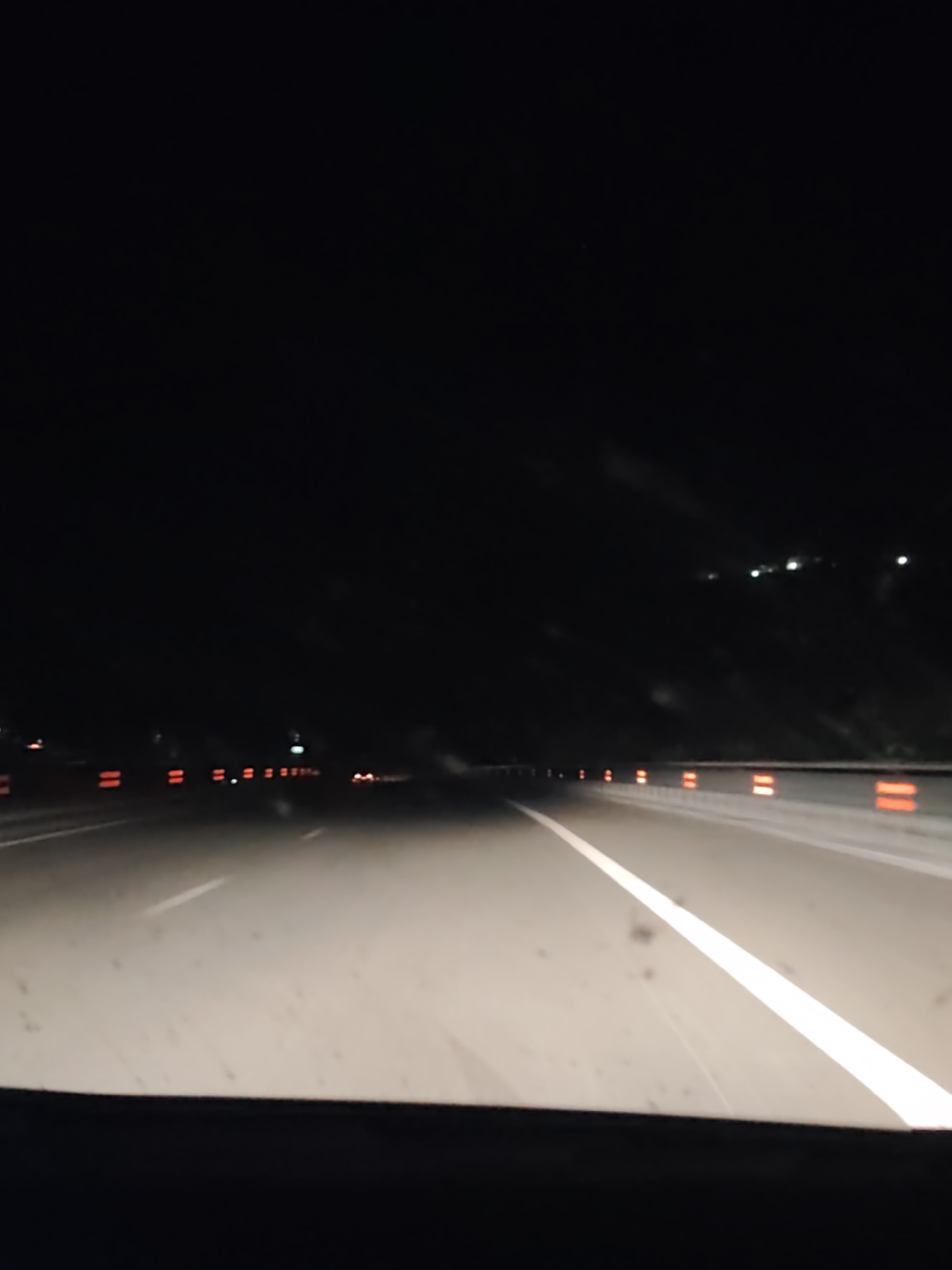 Vehicle travels illuminated highway in Pokrovnik, Bulgaria