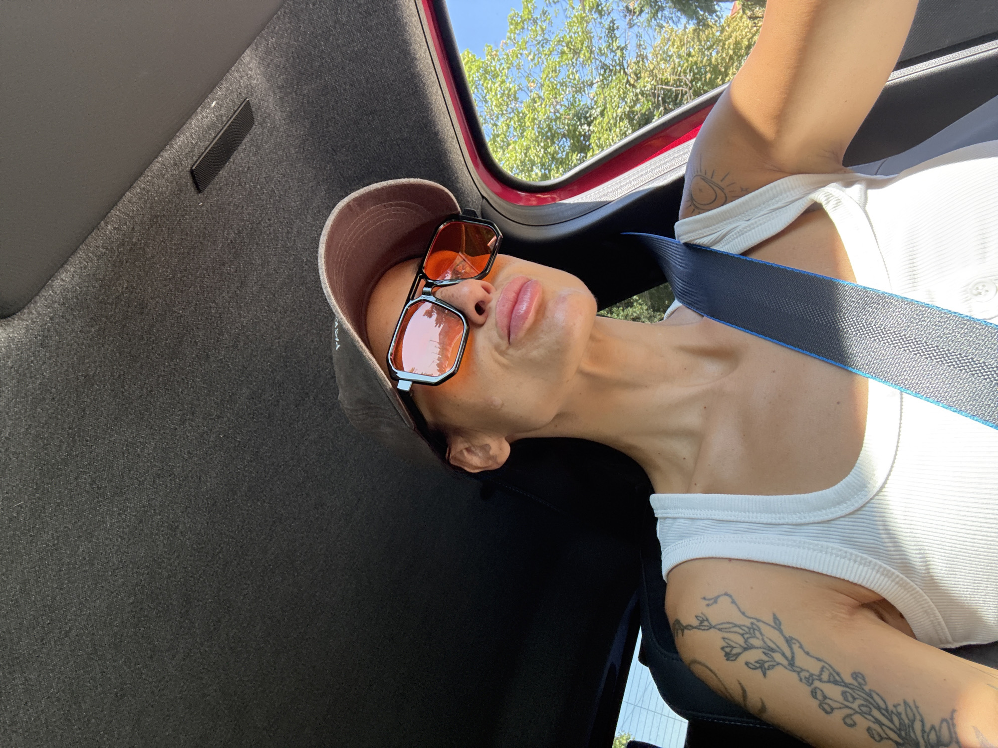 Behind the wheel of a red car in Pleven, Bulgaria