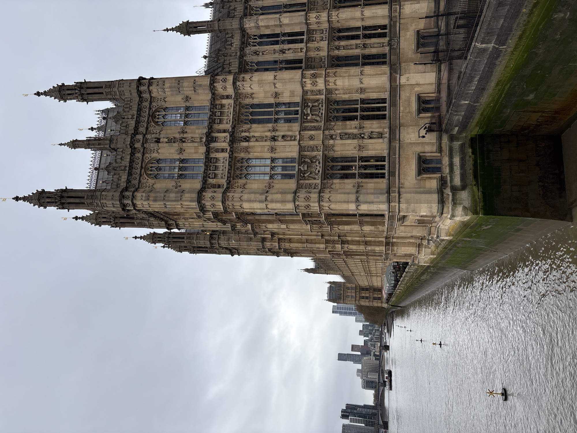 Tourist photographs Big Ben and Parliament from multiple angles