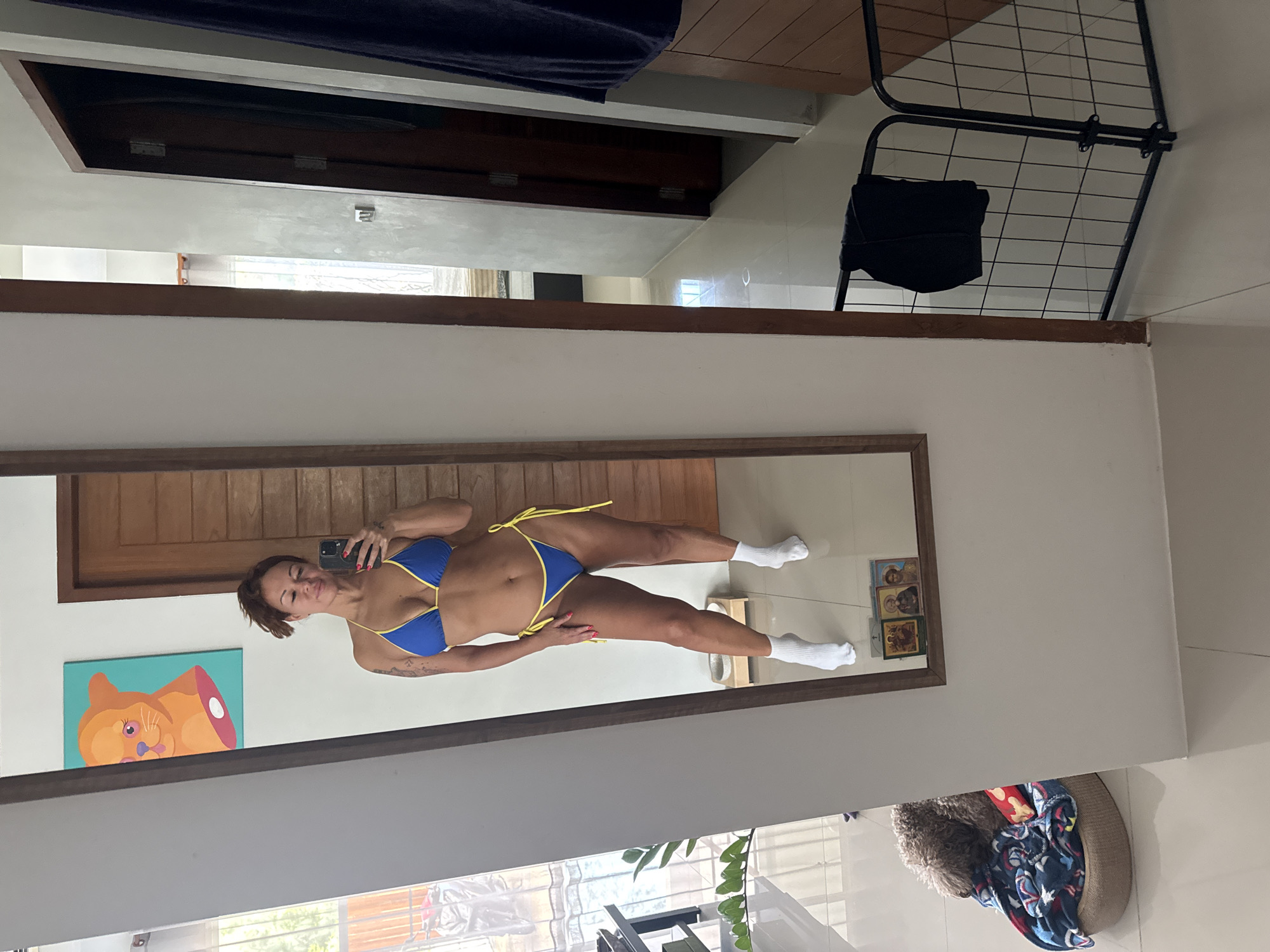 Mirror selfie in a casual home setting, Thep Krasatti