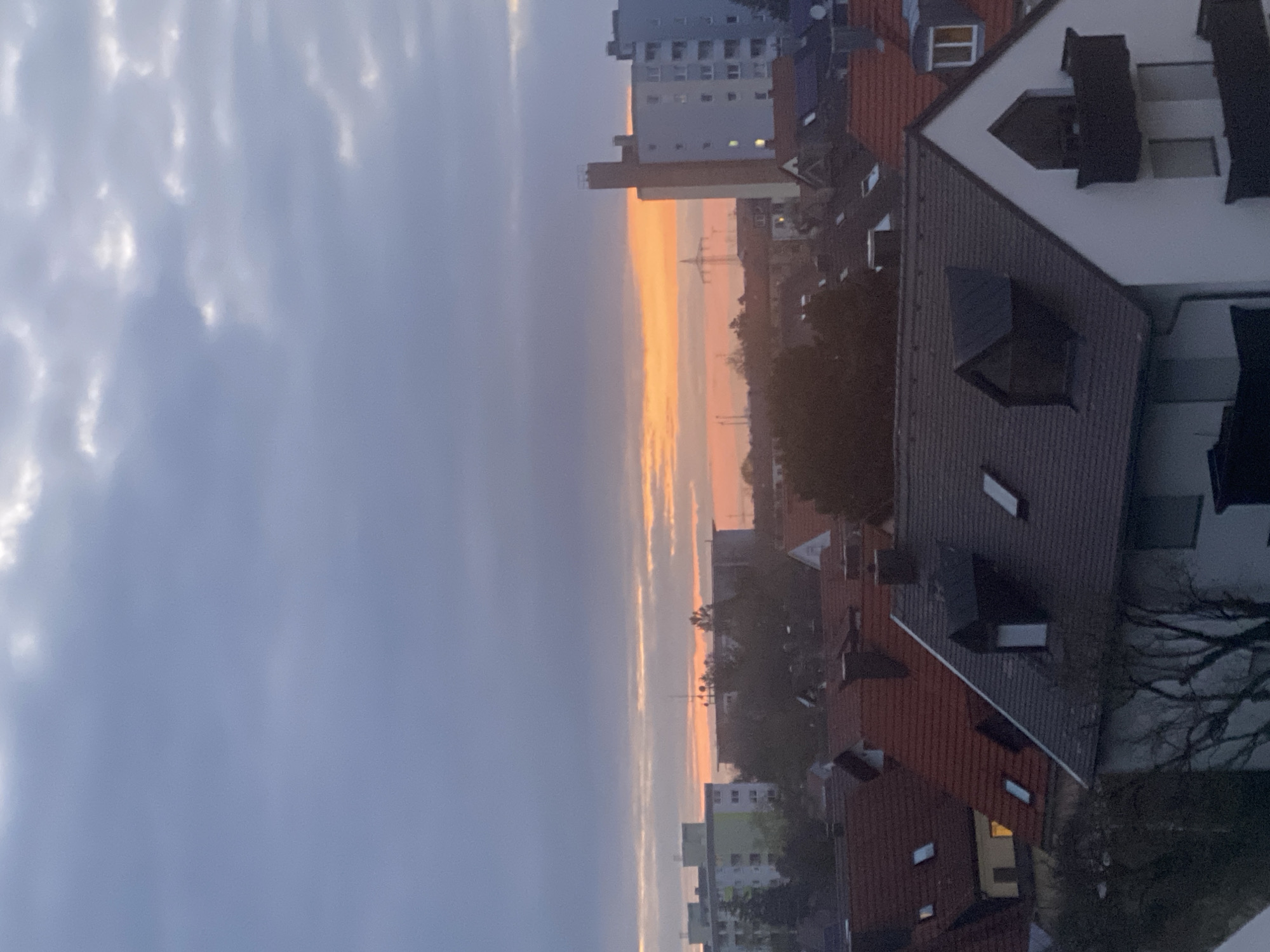 Sunset colors illuminate Munich residential skyline