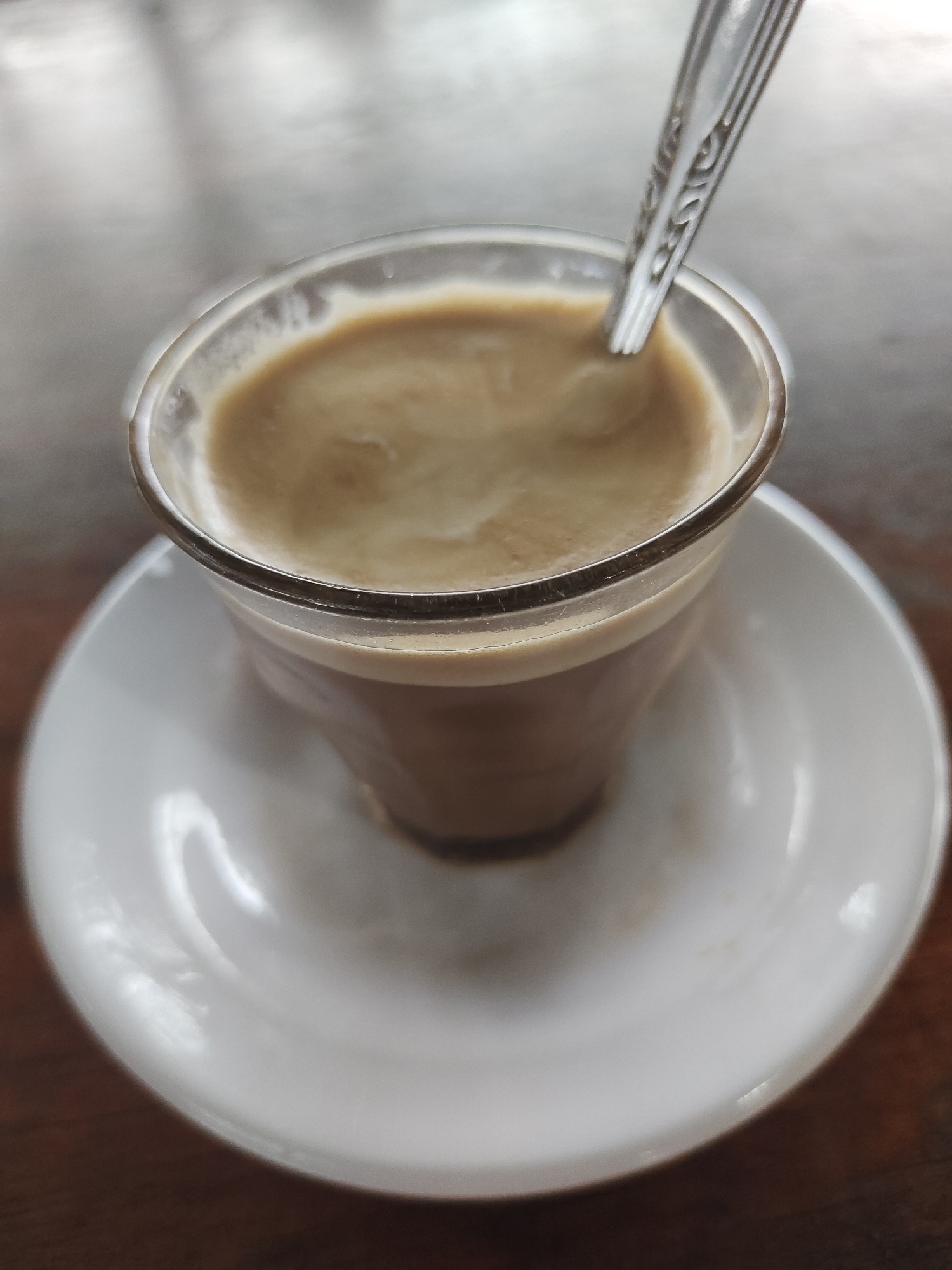 Traditional Indonesian coffee and snacks shared in Keudematangkuli