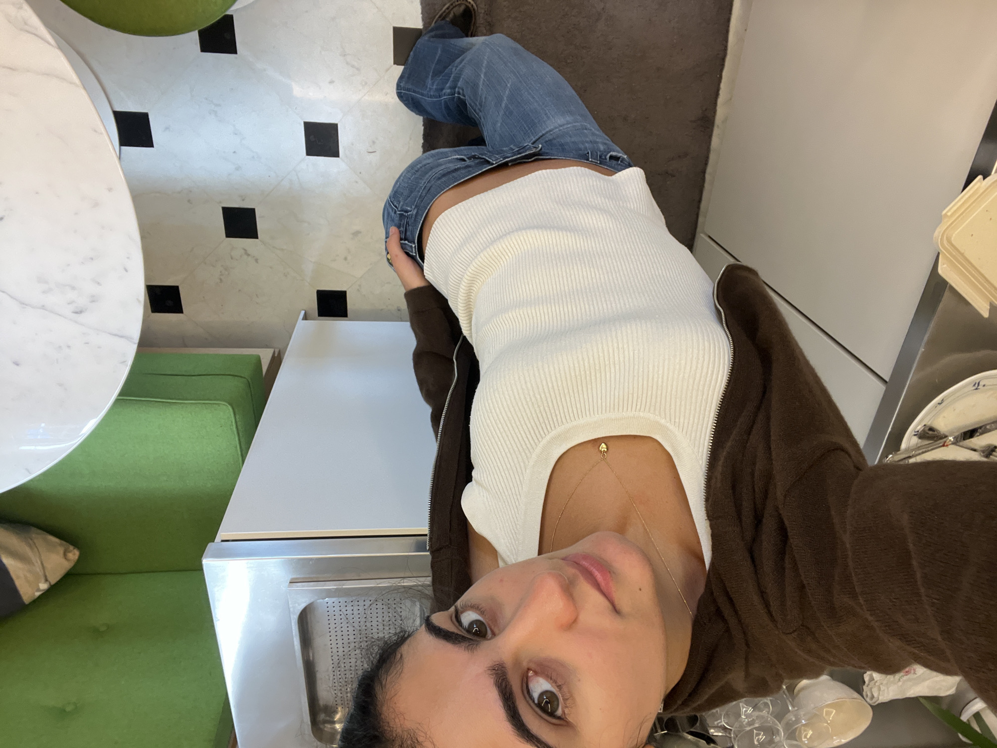 Woman takes high-angle selfies indoors in Paris
