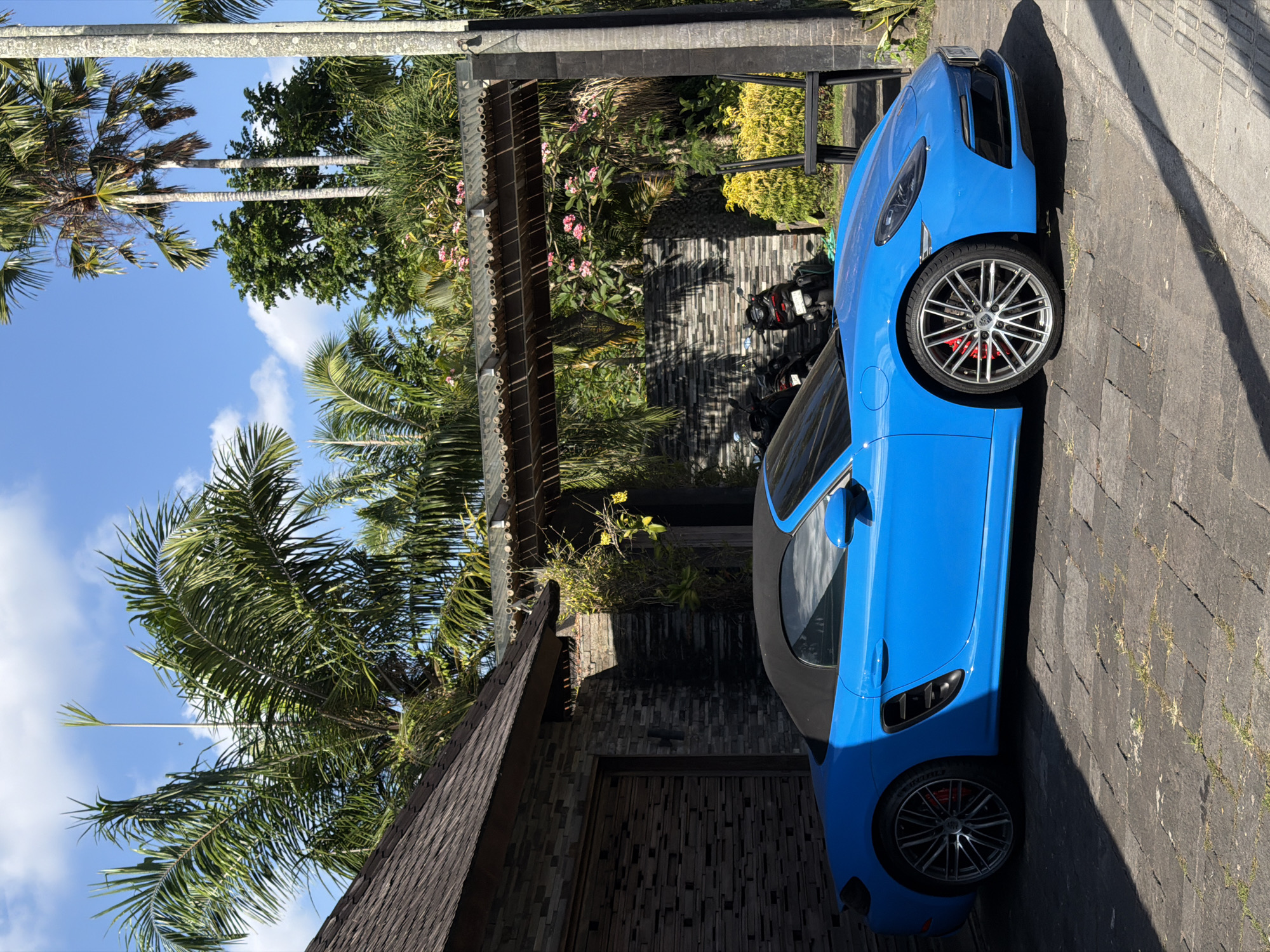 Blue Porsche and street life in North Kuta, Bali