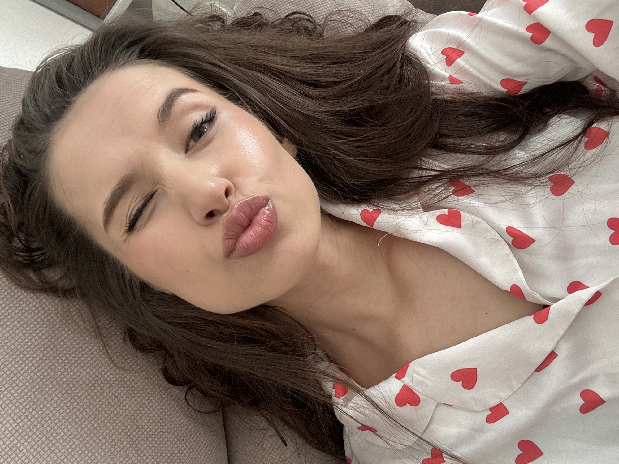 Woman takes morning selfies in heart-patterned pajamas in Yekaterinburg