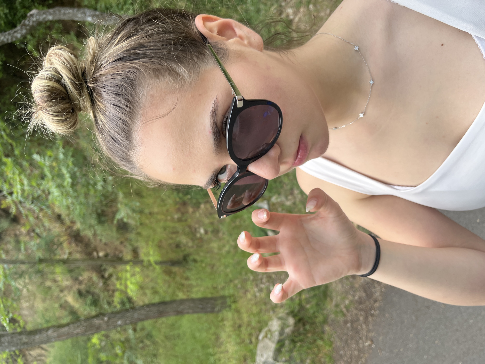 Woman in sunglasses observed outdoors in Blagoevgrad, Bulgaria