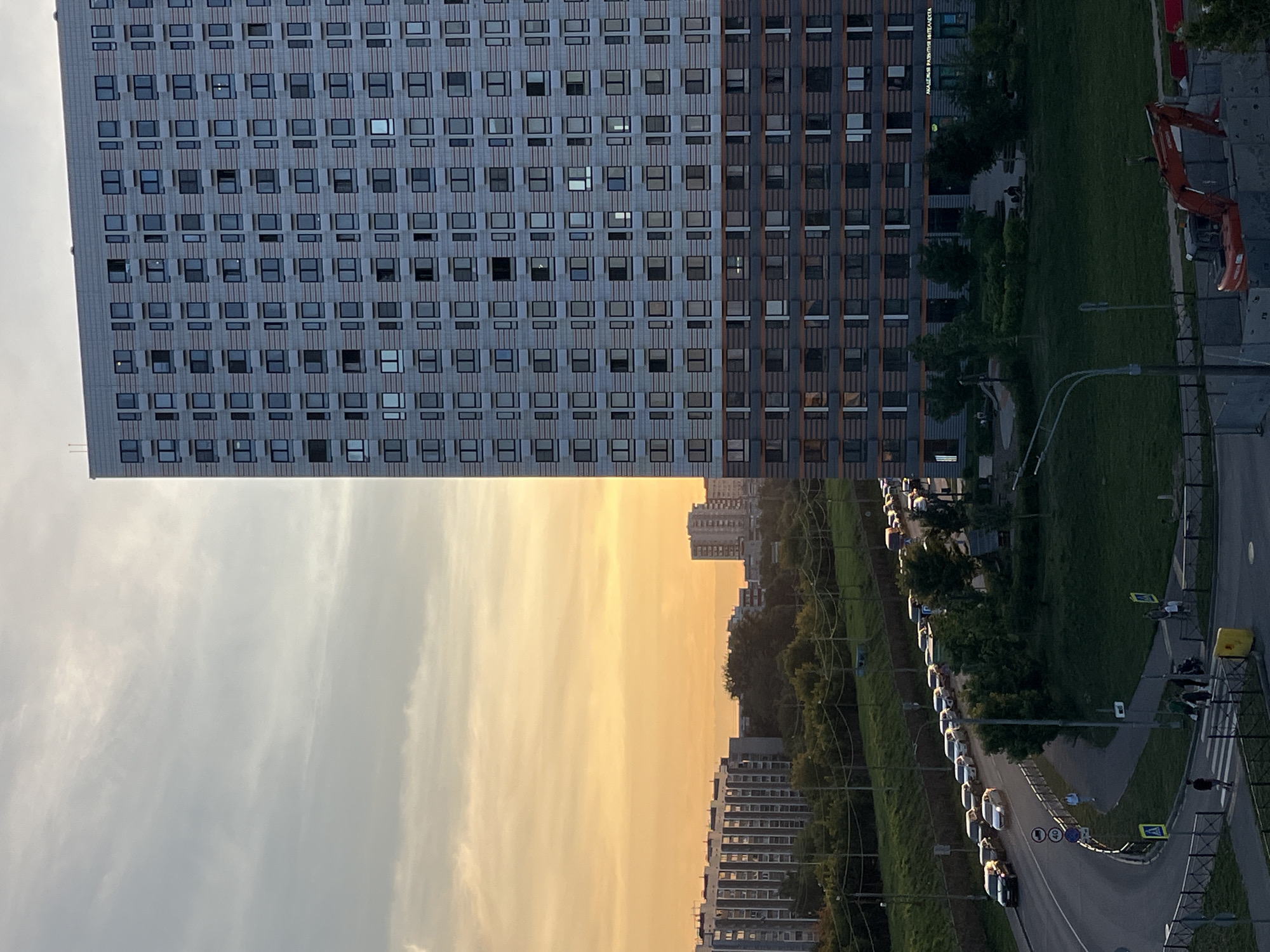 Sunset across Moscow and Lyubertsy, with robots on the sidewalk