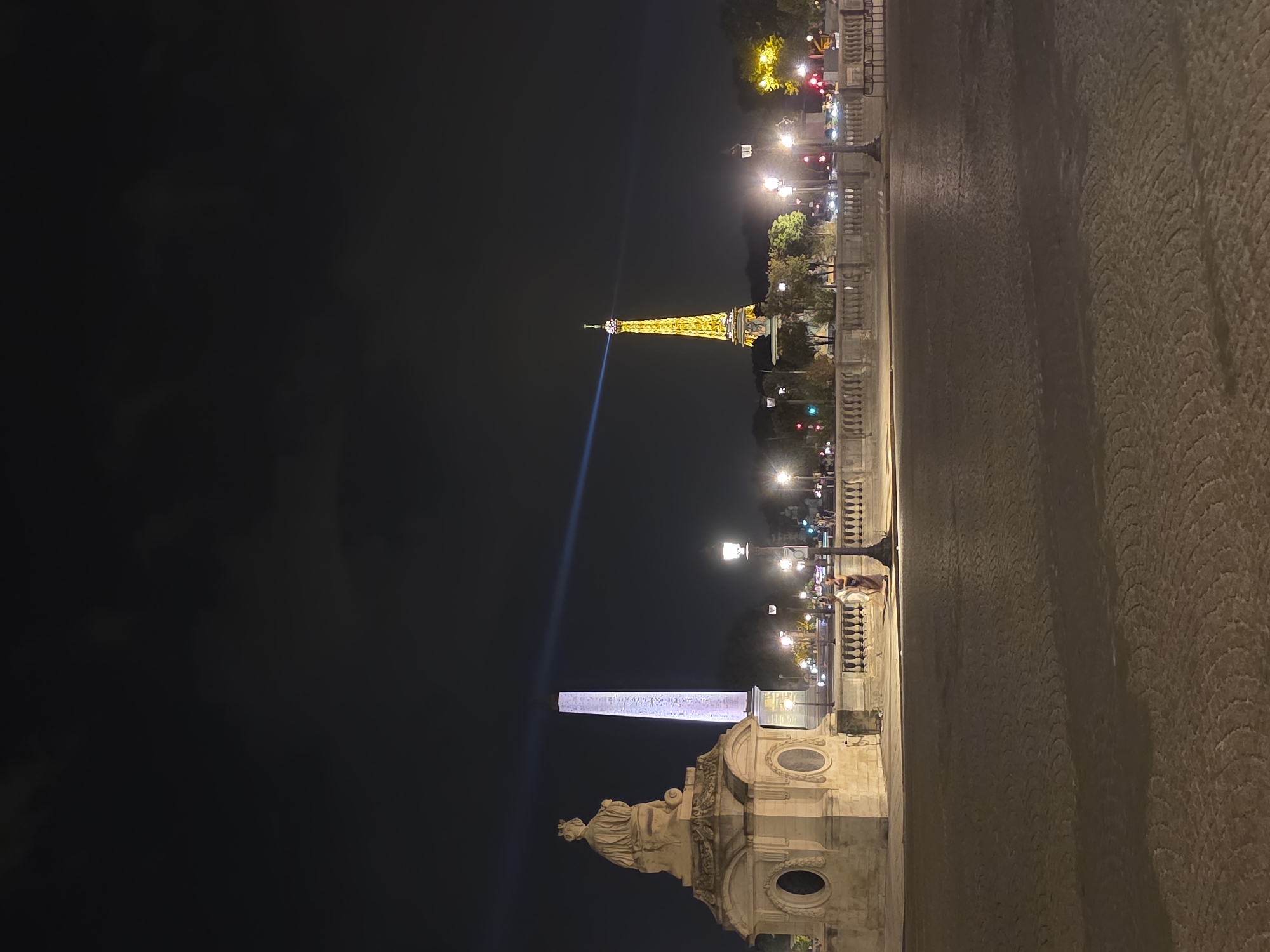 Three iconic Paris landmarks glowing on a June night
