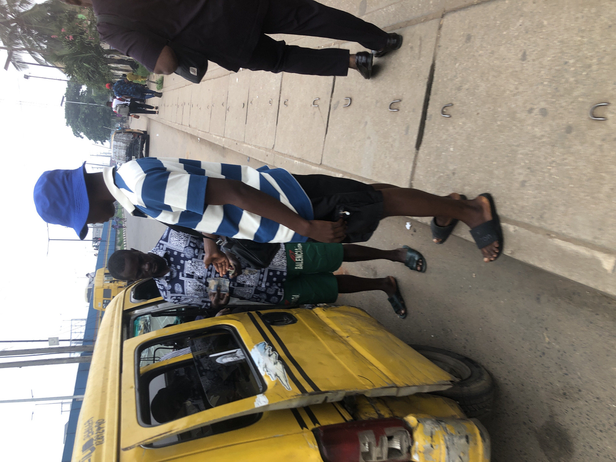 Overturned truck and street activity along Lagos road corridor