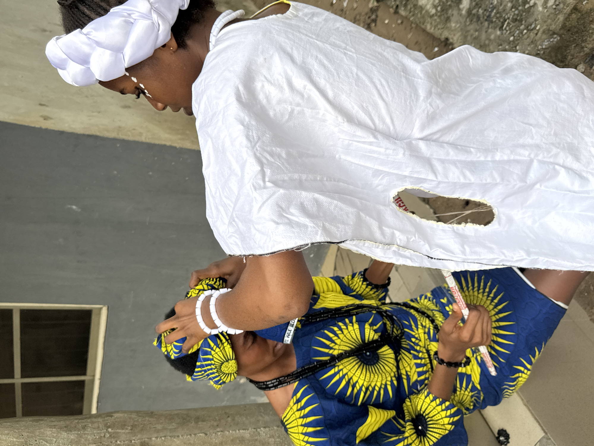 Traditional headwrap ceremony between two women in Badagry, Nigeria