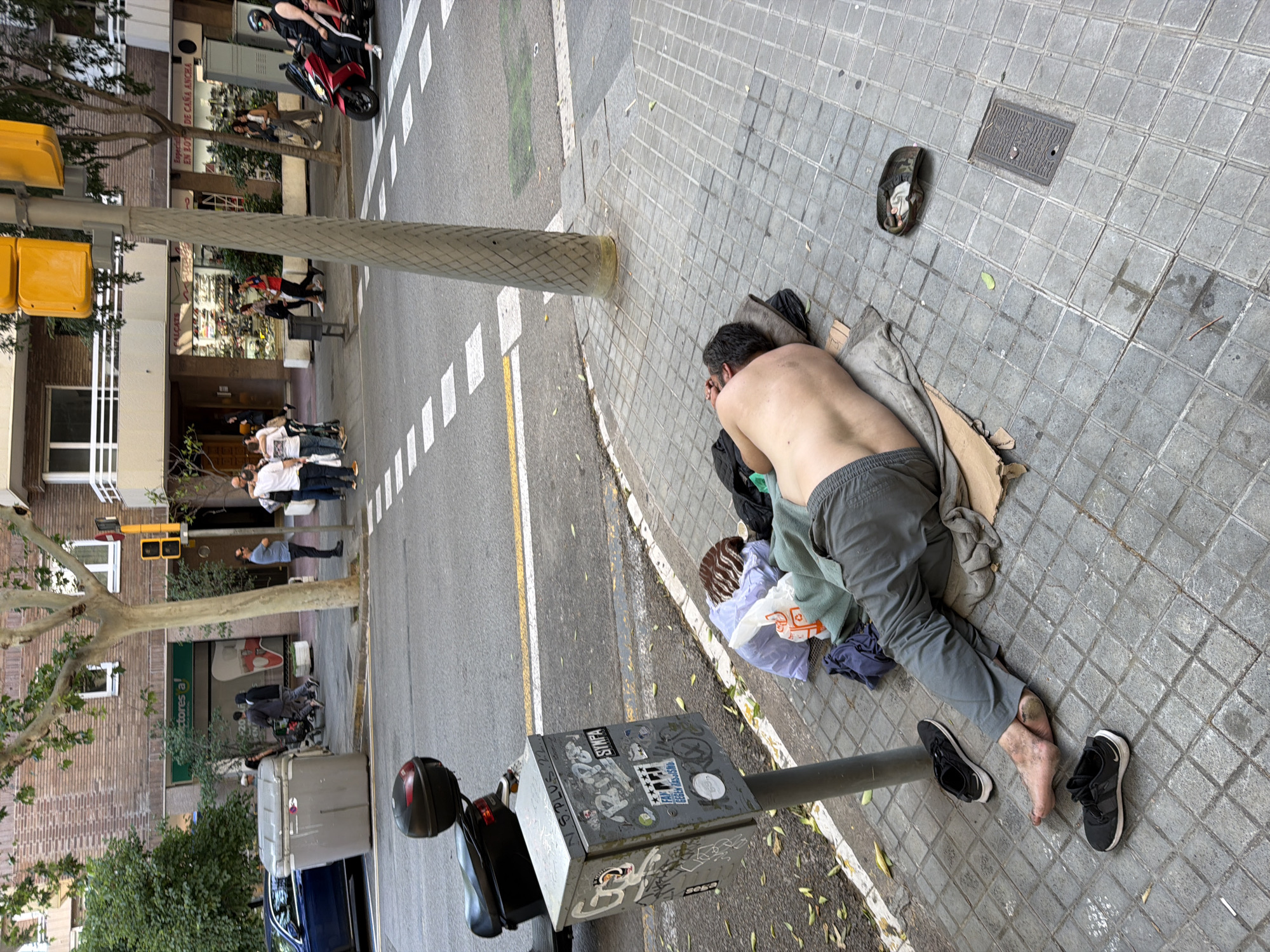 Medical emergency response captured on Barcelona street near florist