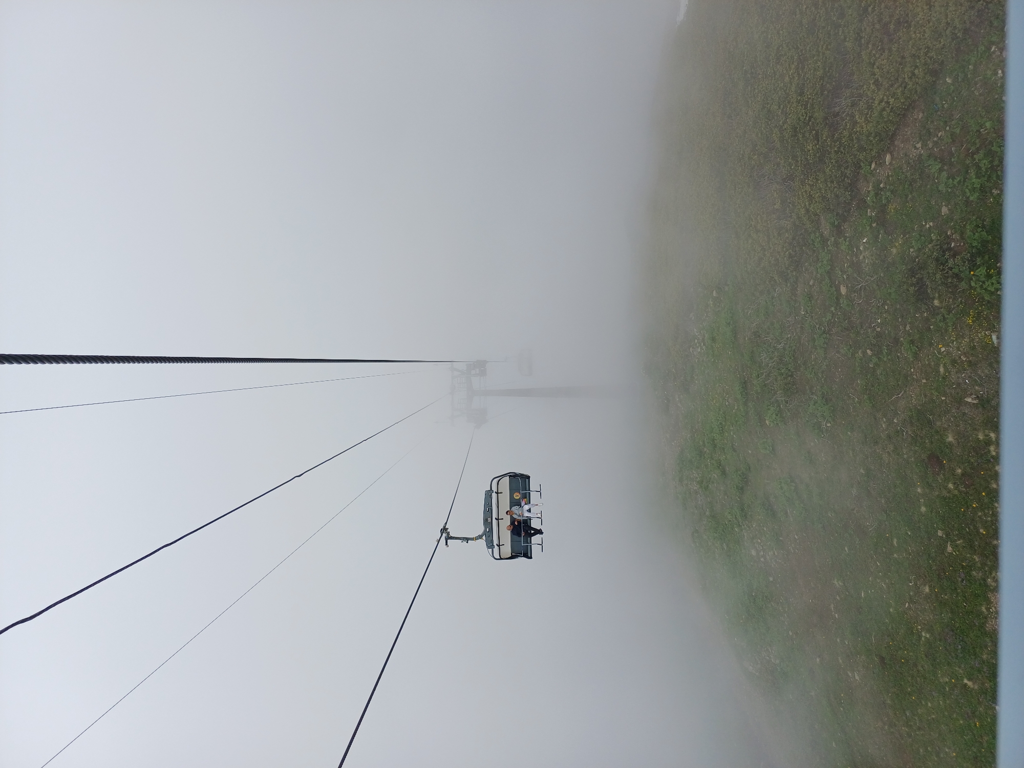 Foggy summer morning at a ski lift in Estosadok, Russia